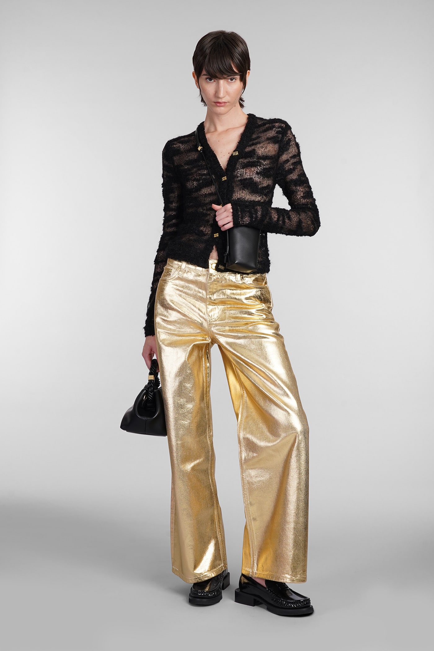 Shop Ganni Jeans In Gold Cotton