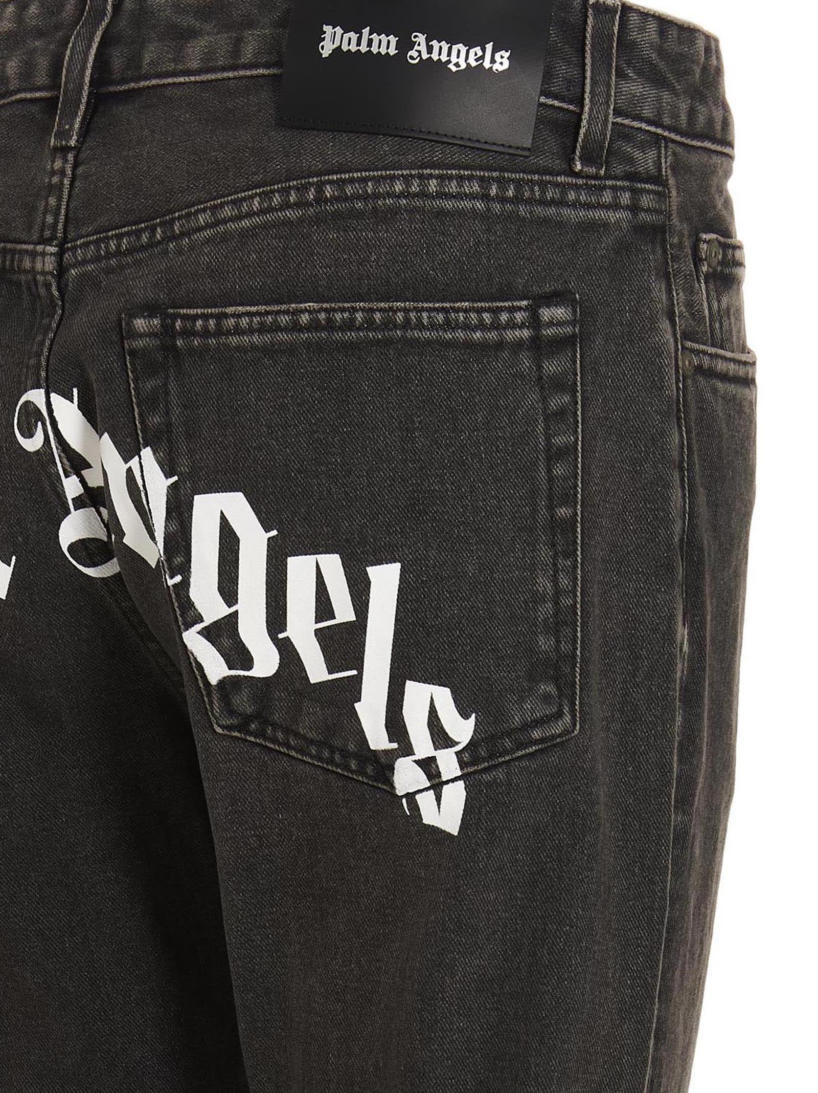 Shop Palm Angels Jeans Curved Logo In Nero