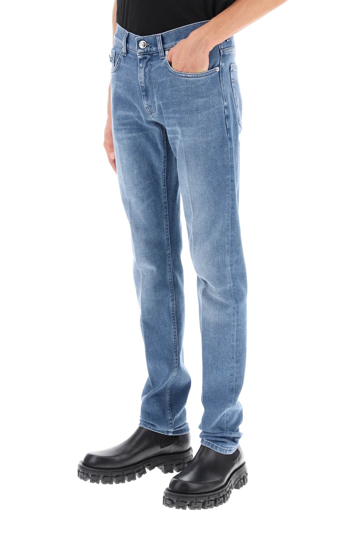 Shop Versace Stretch Denim Slim Fit Jeans In Washed Medium Blue (light Blue)