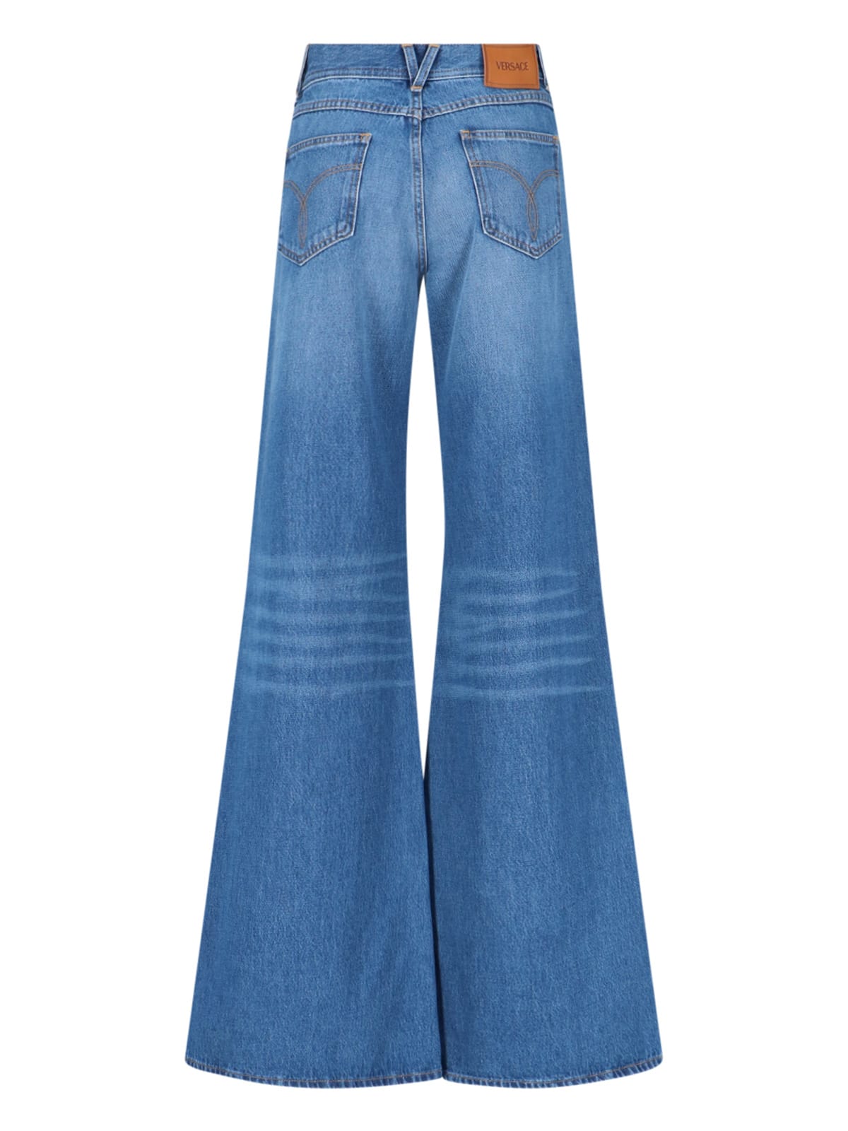 Shop Versace Wide Jeans In Blue