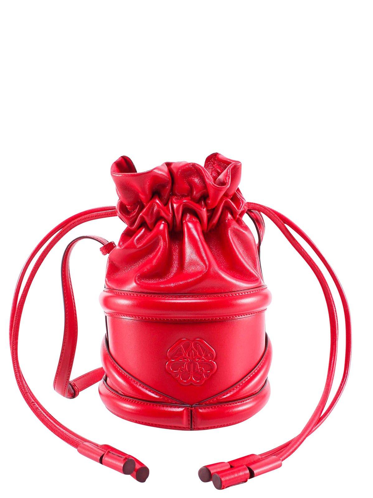 Shop Alexander Mcqueen Logo Detailed Drawstring Bucket Bag In Red