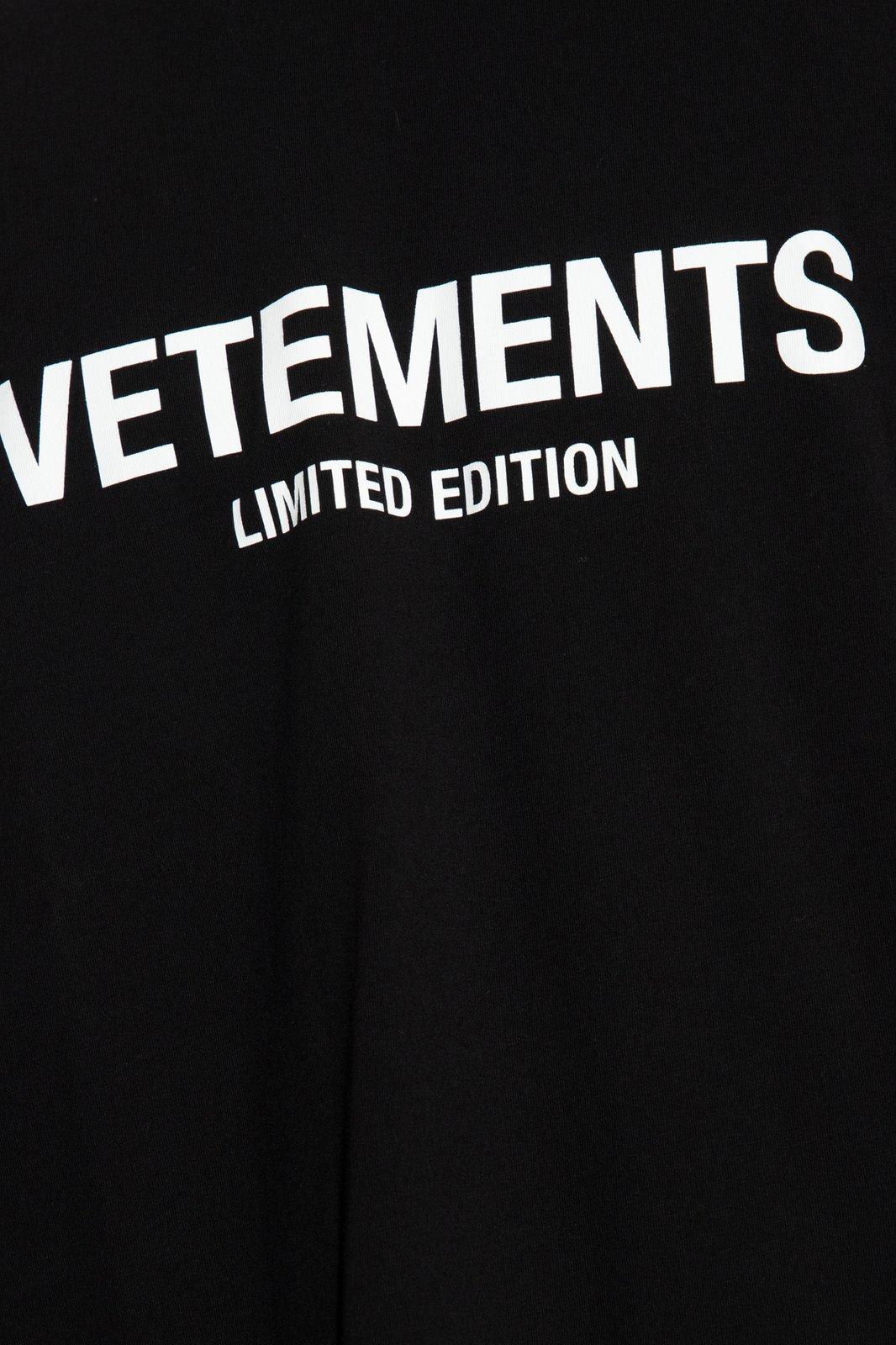Shop Vetements Logo Printed Crewneck T-shirt In Black