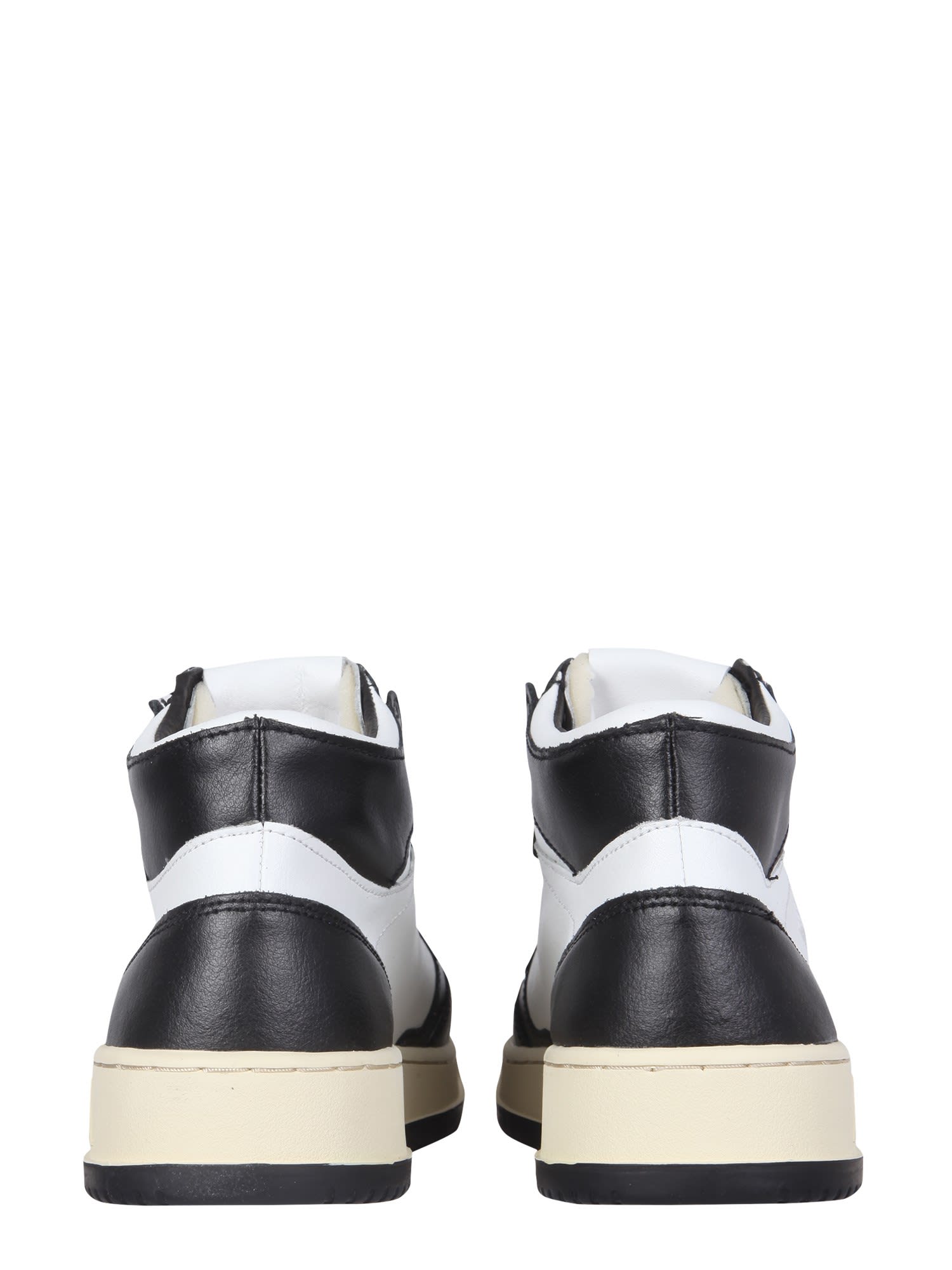 Shop Autry Medalist Mid Cut Sneakers In Black/white