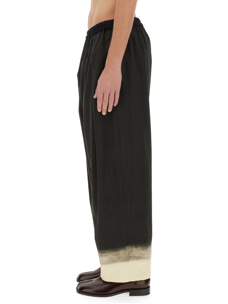 Shop Maison Margiela Trompe Loeil Pinstripe Pants In Black