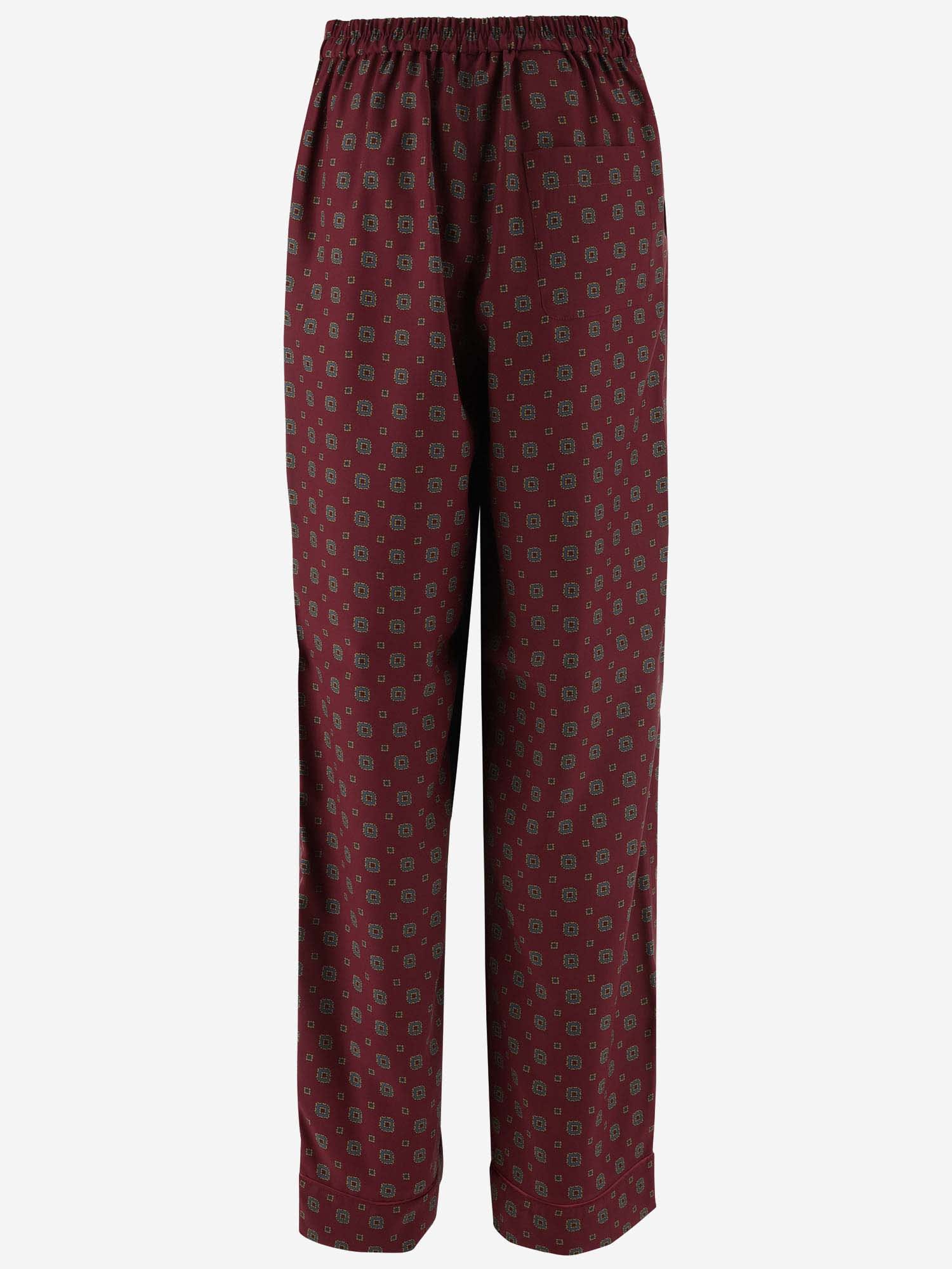 Shop Moschino Patterned Pants In Red