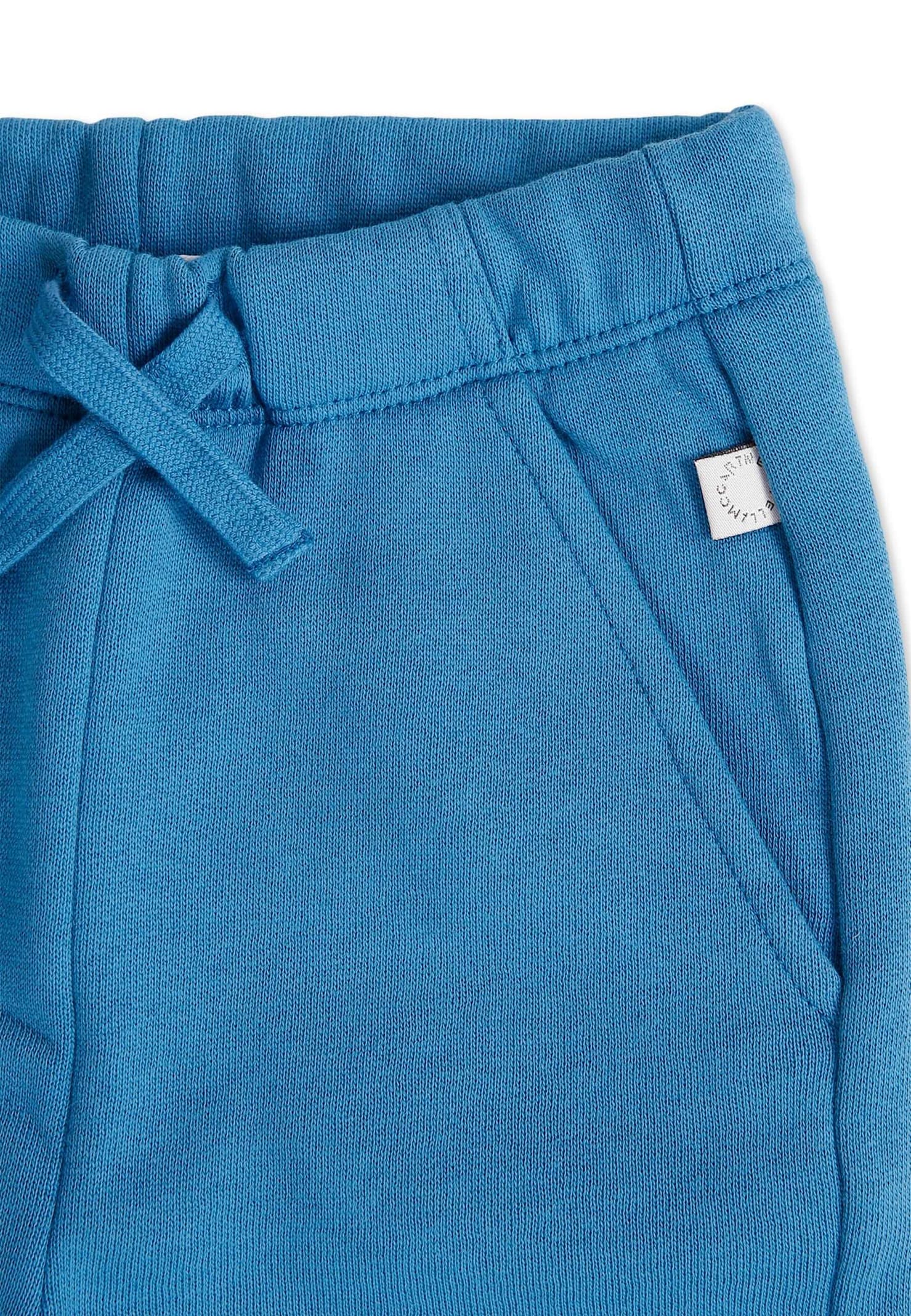 Stella Mccartney Blue Pants For Baby Boy With Smiling Sun And World In Blue