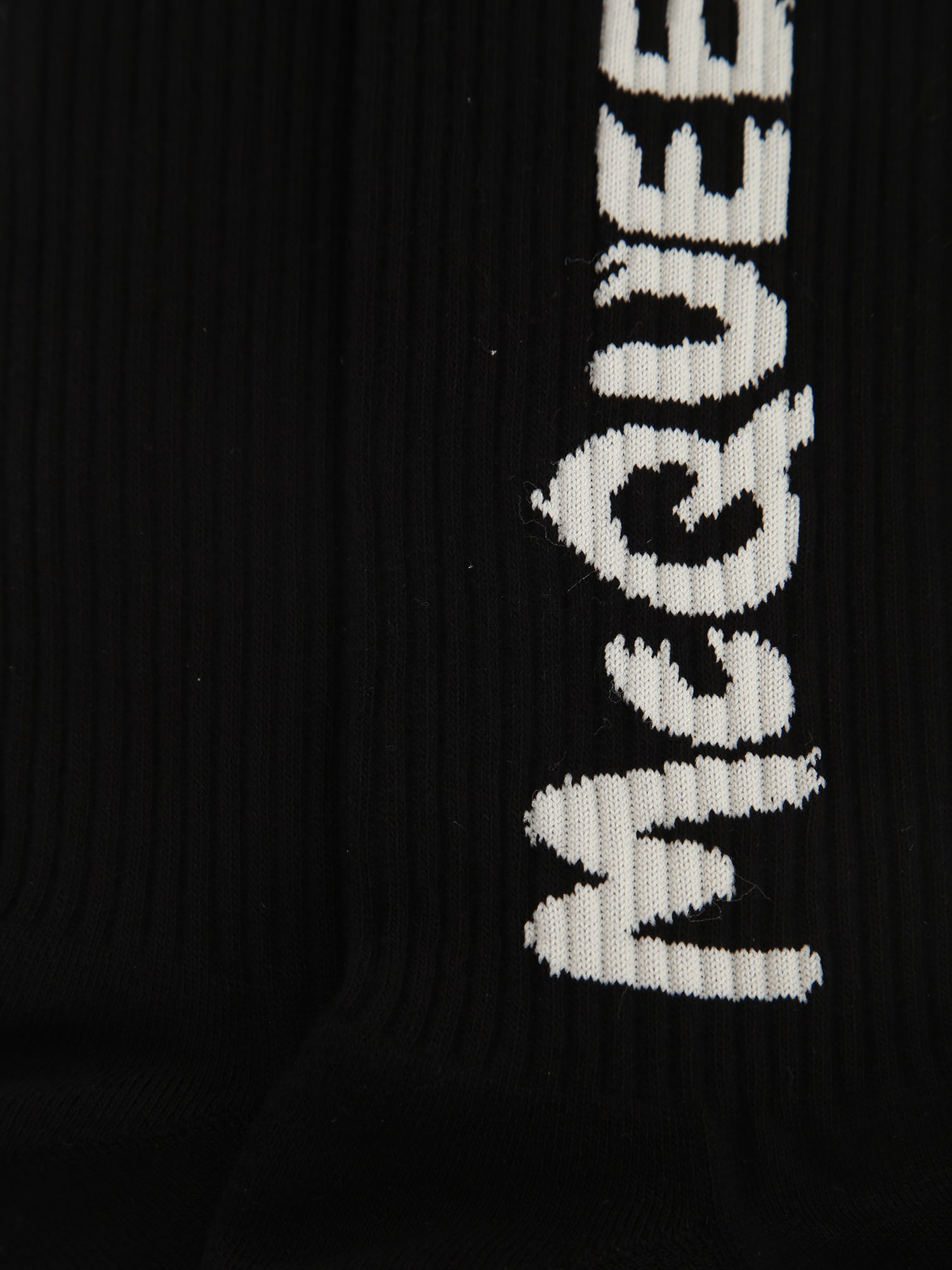 Shop Alexander Mcqueen Ribbed-knit Logo Socks In Black