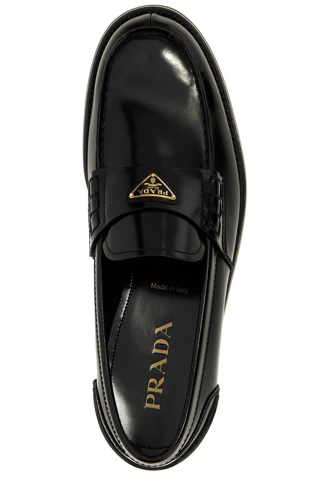 Prada Triangular Plaque Loafers In Black