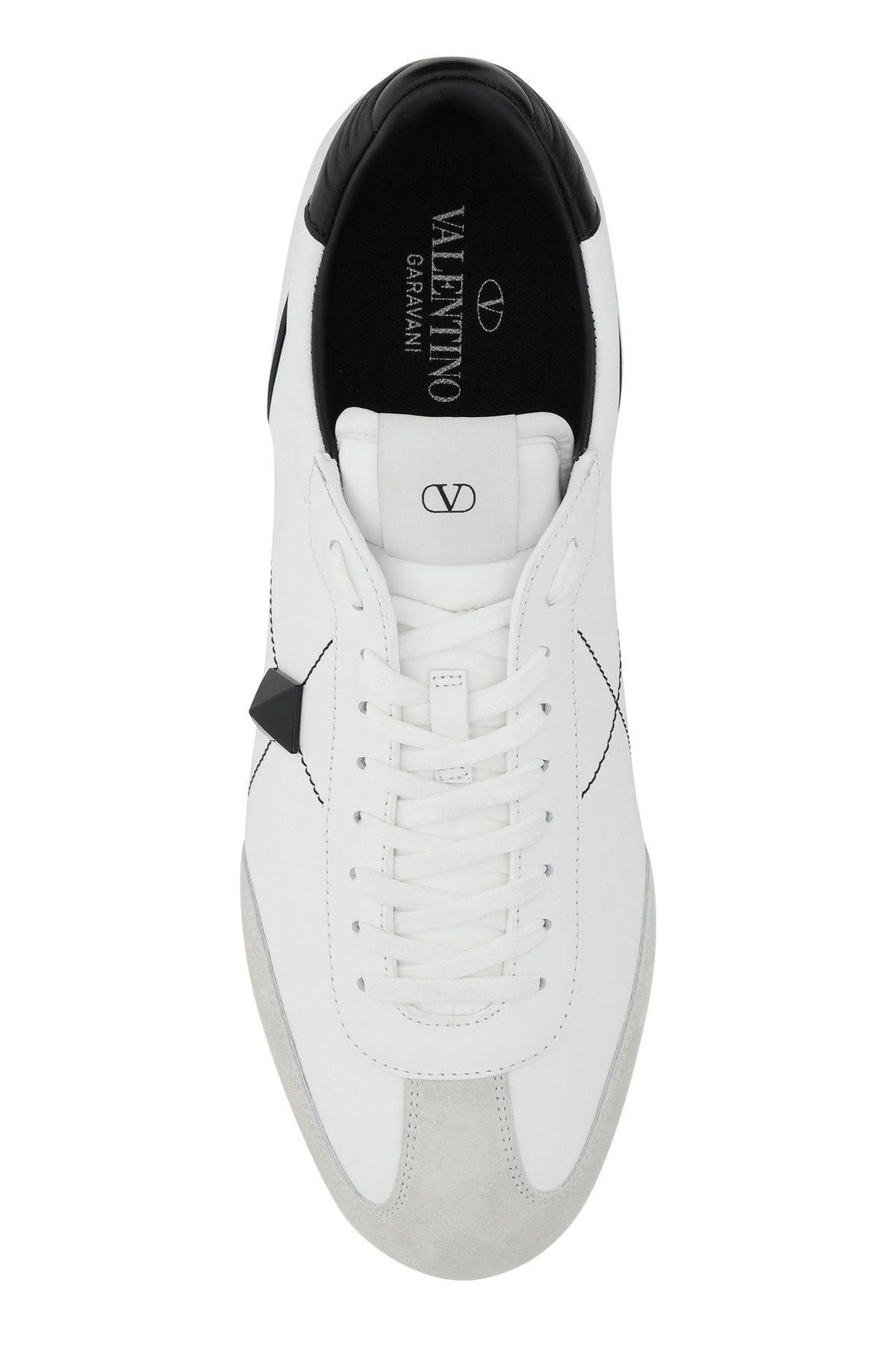 Shop Valentino White Leather Stud Around Sneakers In White, Black