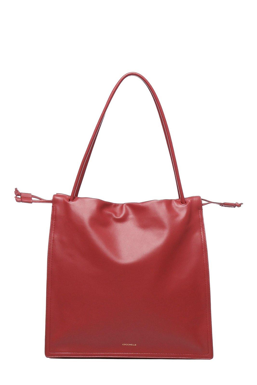 Coccinelle Logo Embossed Drawstring Tote Bag In Red