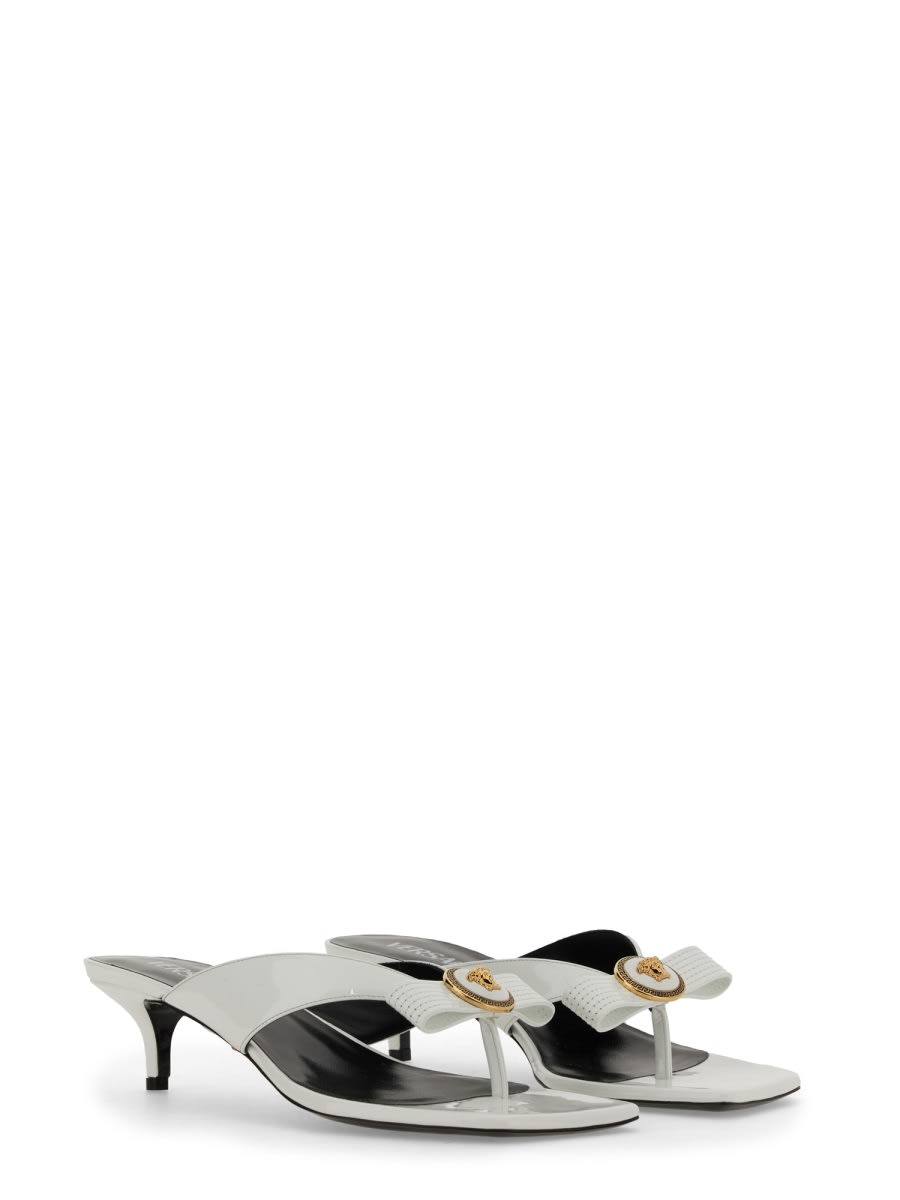 Shop Versace Low Sabots Gianni Ribbon In White