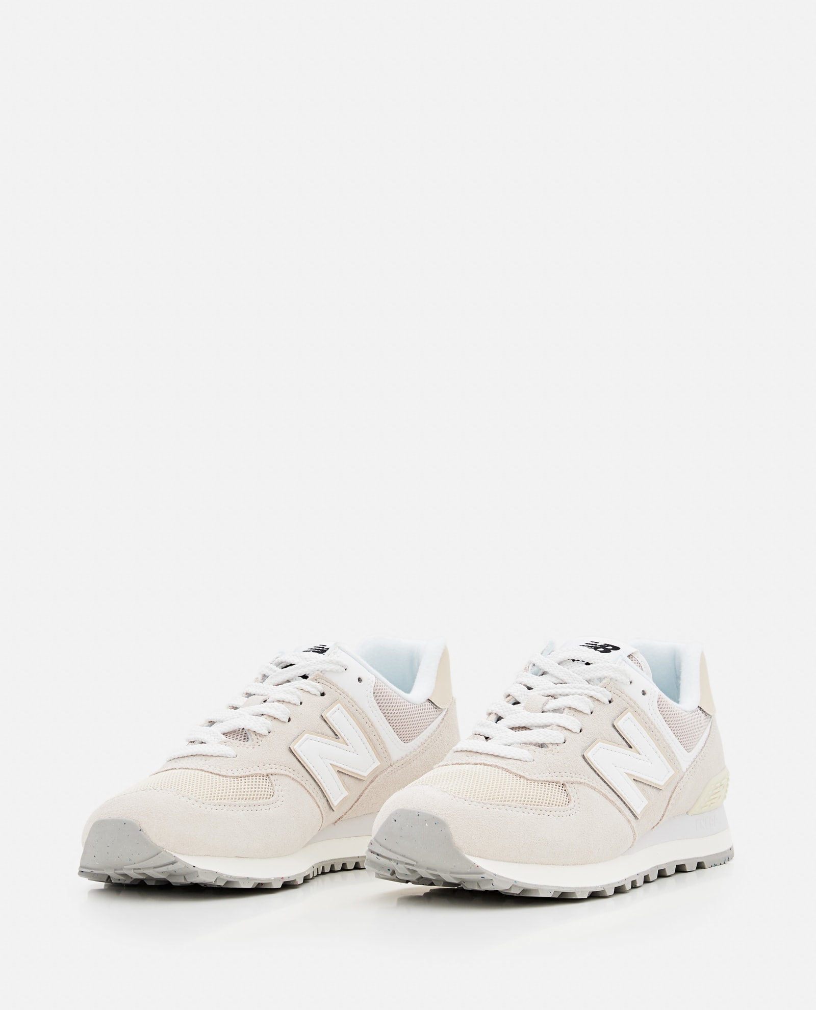Shop New Balance U574 Sneakers In White