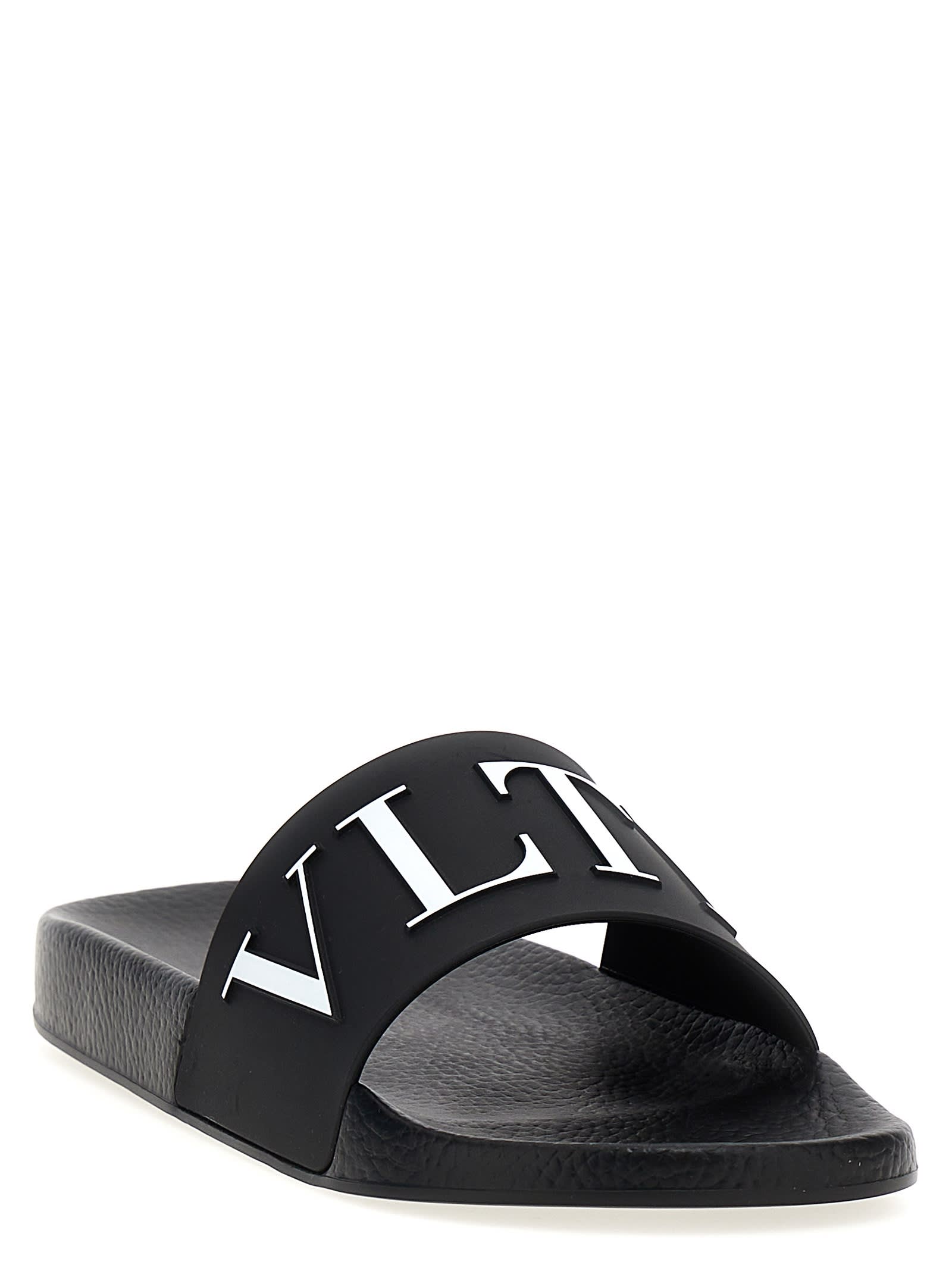 Shop Valentino Garavani Vltn Slides In White/black