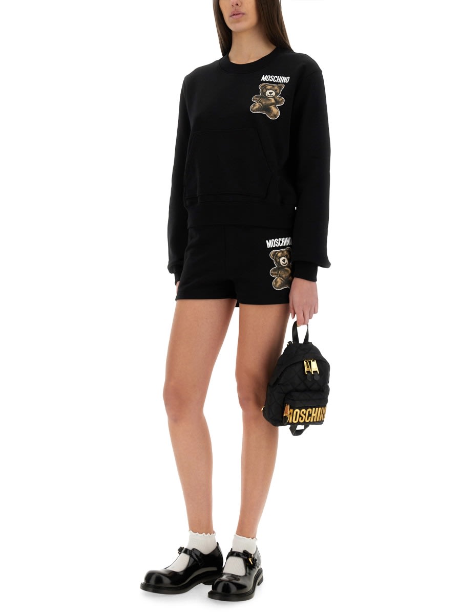Shop Moschino Teddy Bear In Black
