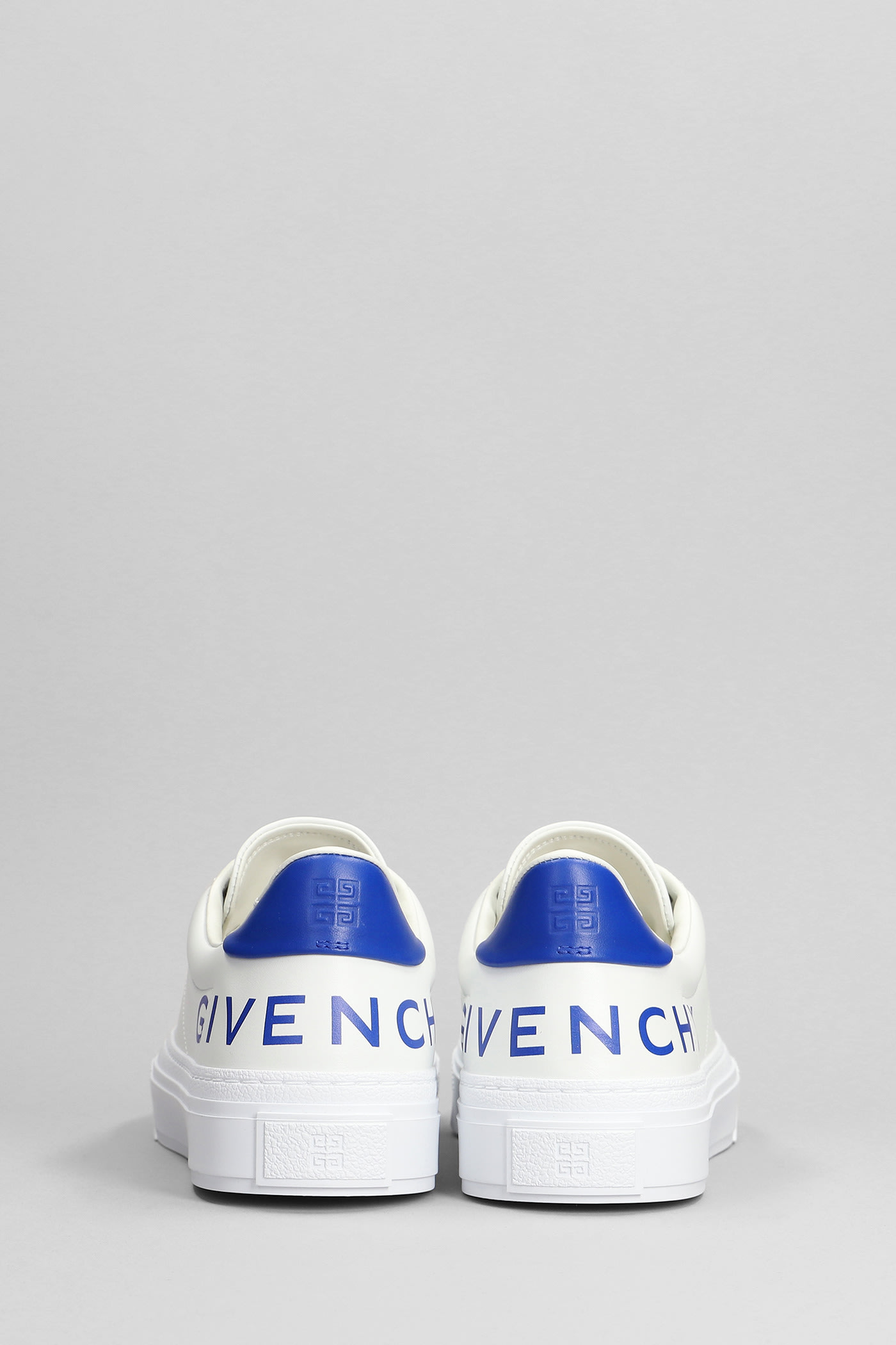 Shop Givenchy City Sport Sneakers In White Leather