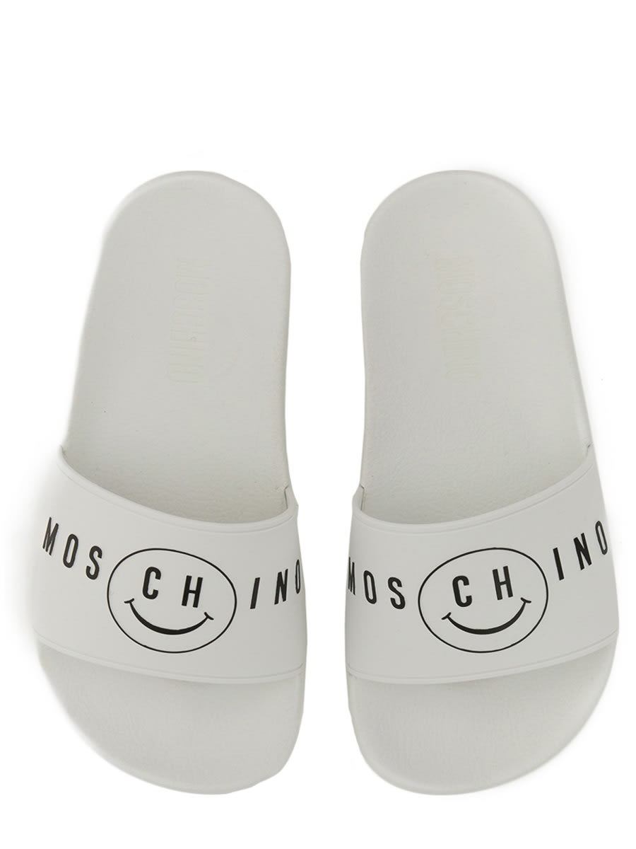 Shop Moschino Slide Sandal With Smile Logo In White