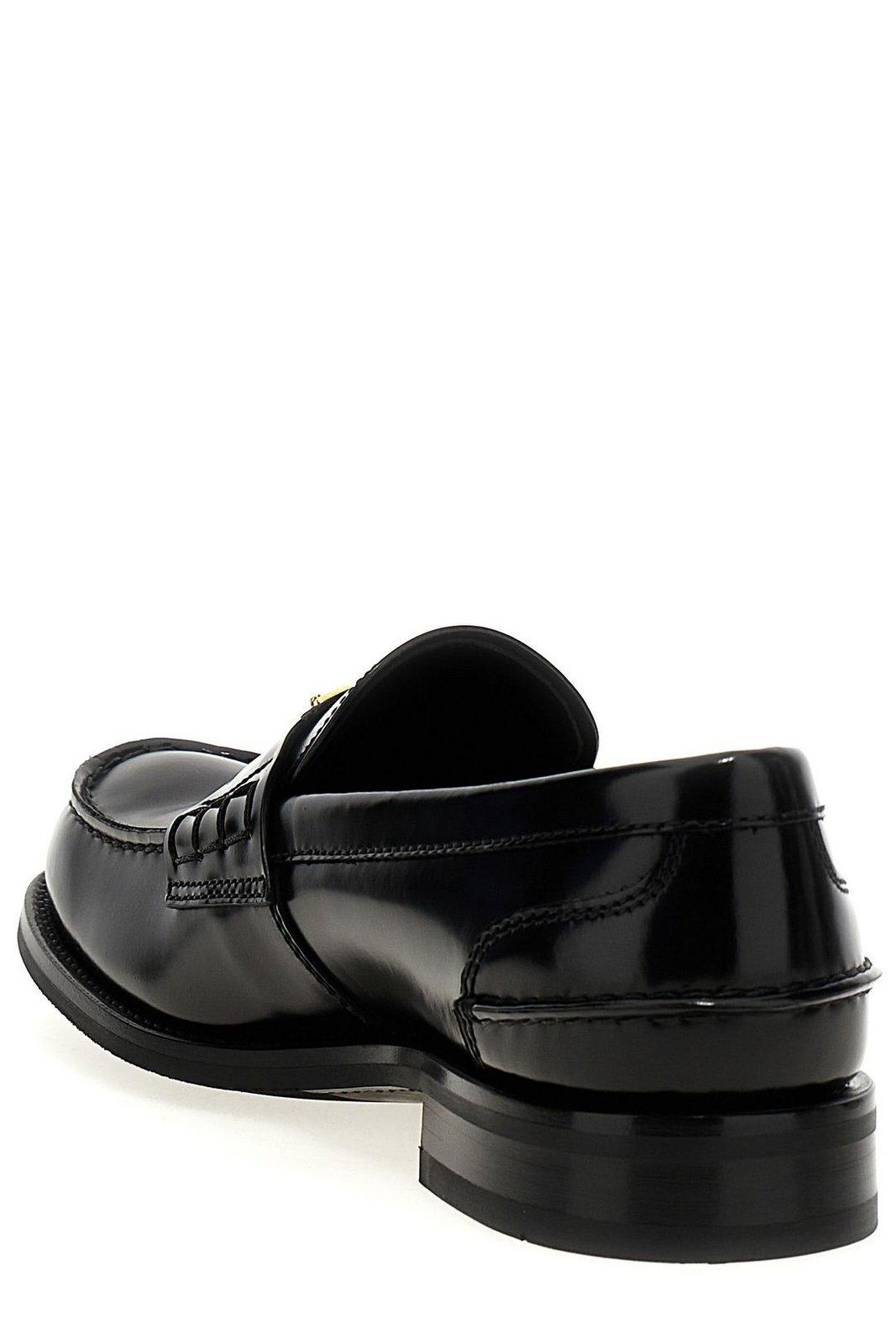 Prada Triangular Plaque Loafers In Black