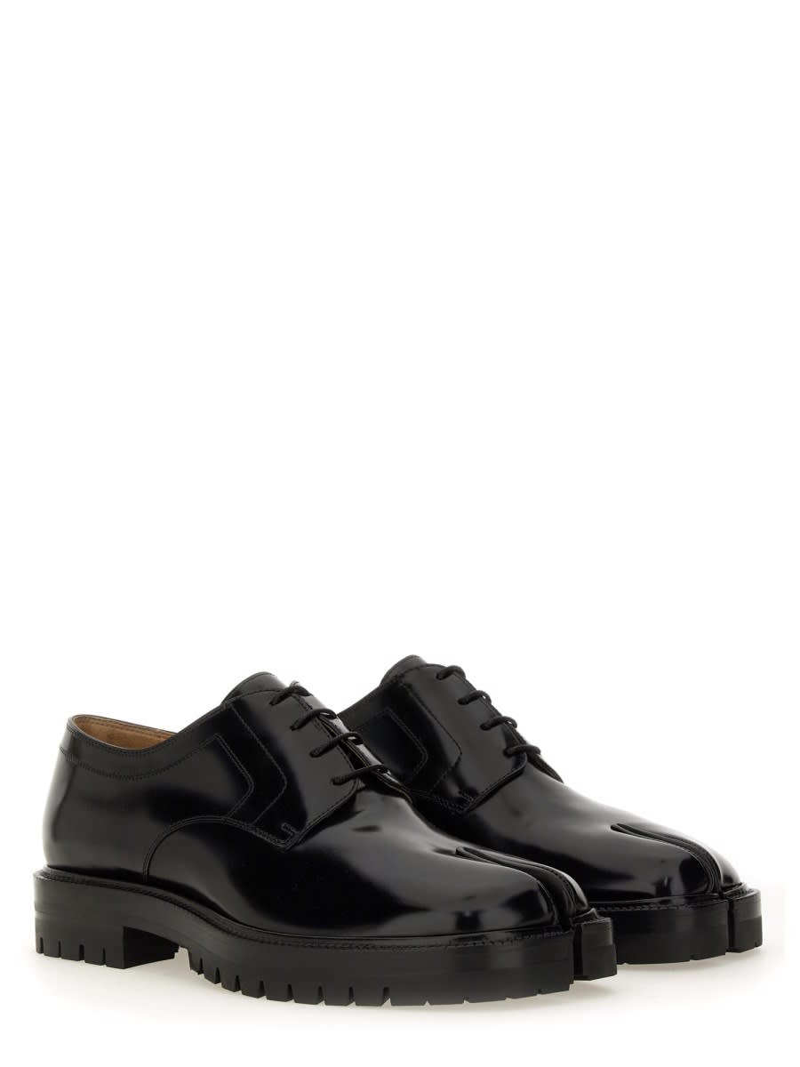 Shop Maison Margiela Tabi Lace-up. In Black