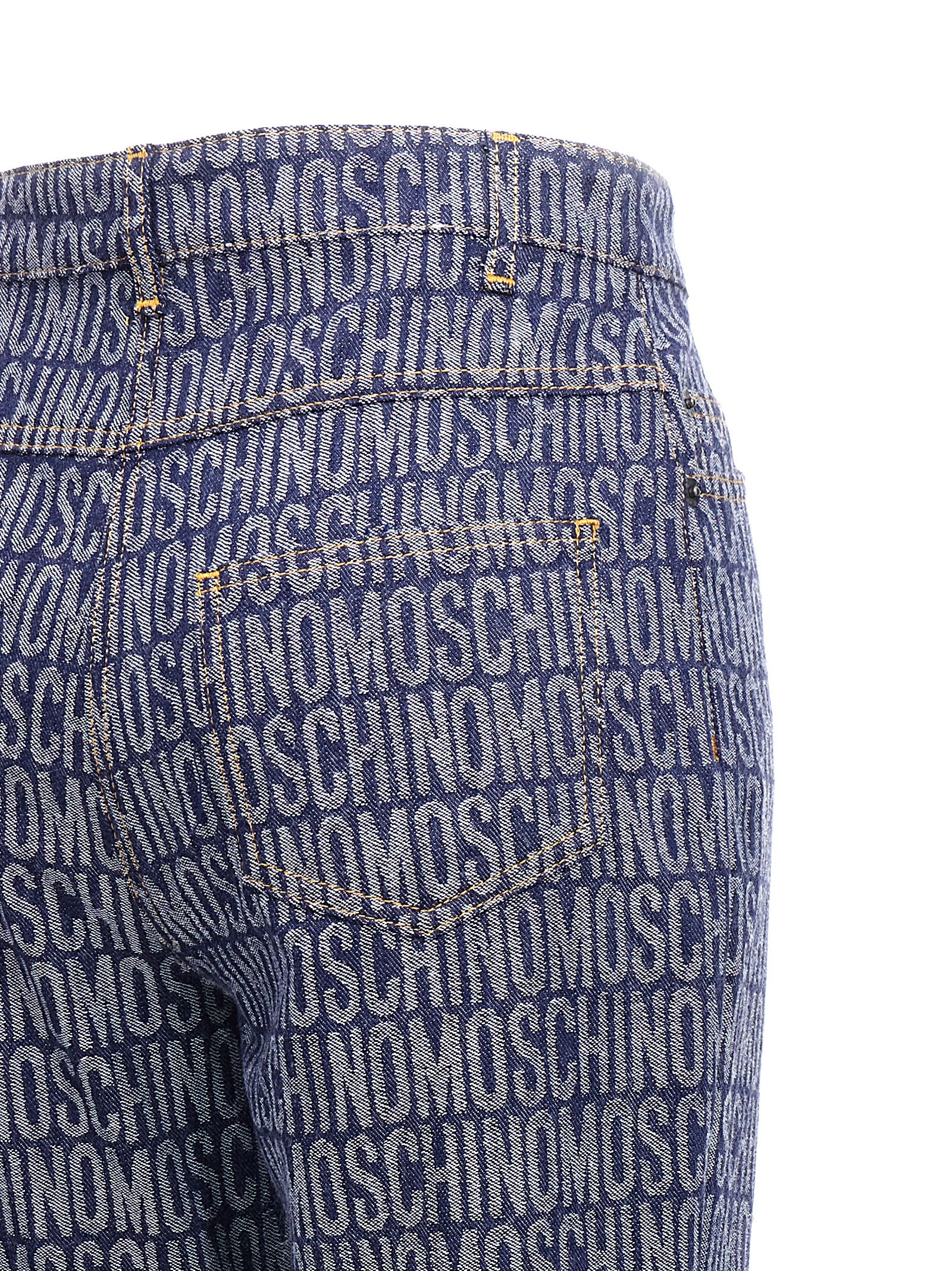 Shop Moschino Logo Jeans In Blue