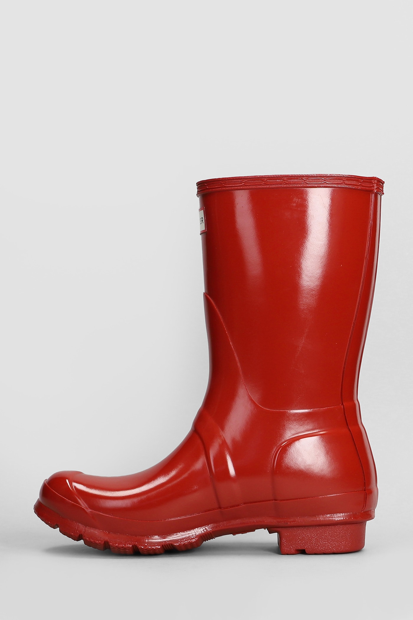 Shop Hunter Original Short Gloss Low Heels Boots In Red Rubber/plasic