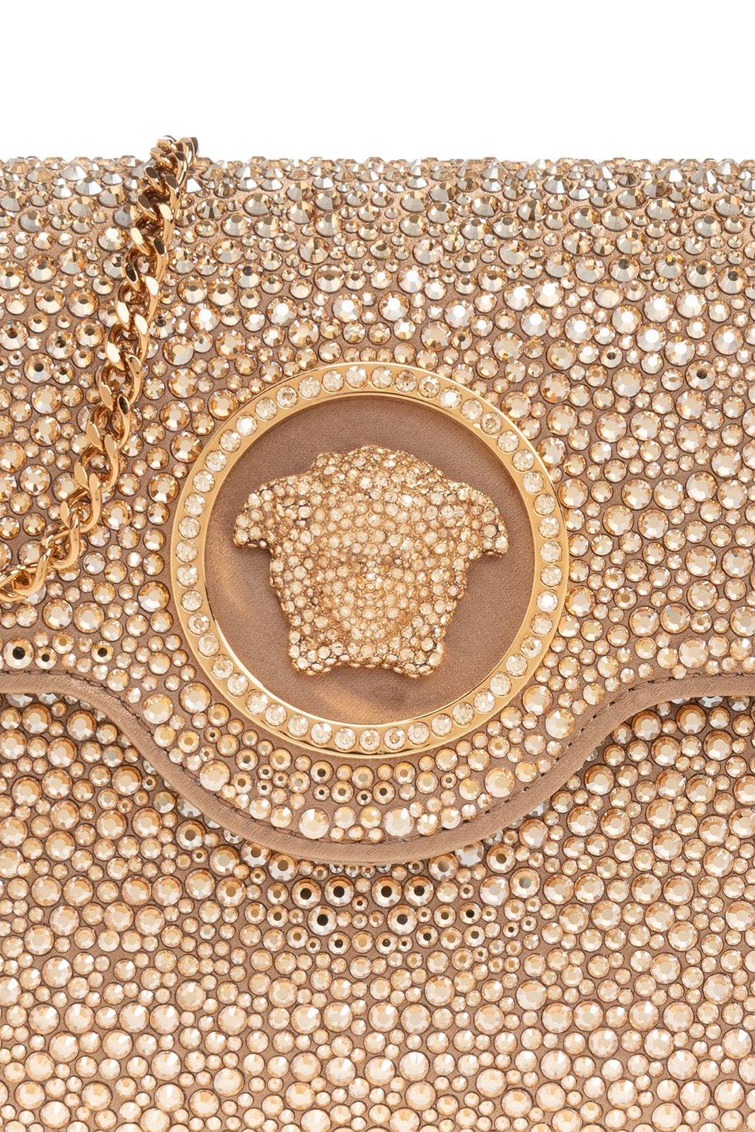 Shop Versace Medusa Plaque Embellished Clutch Bag In Neutrals/gold