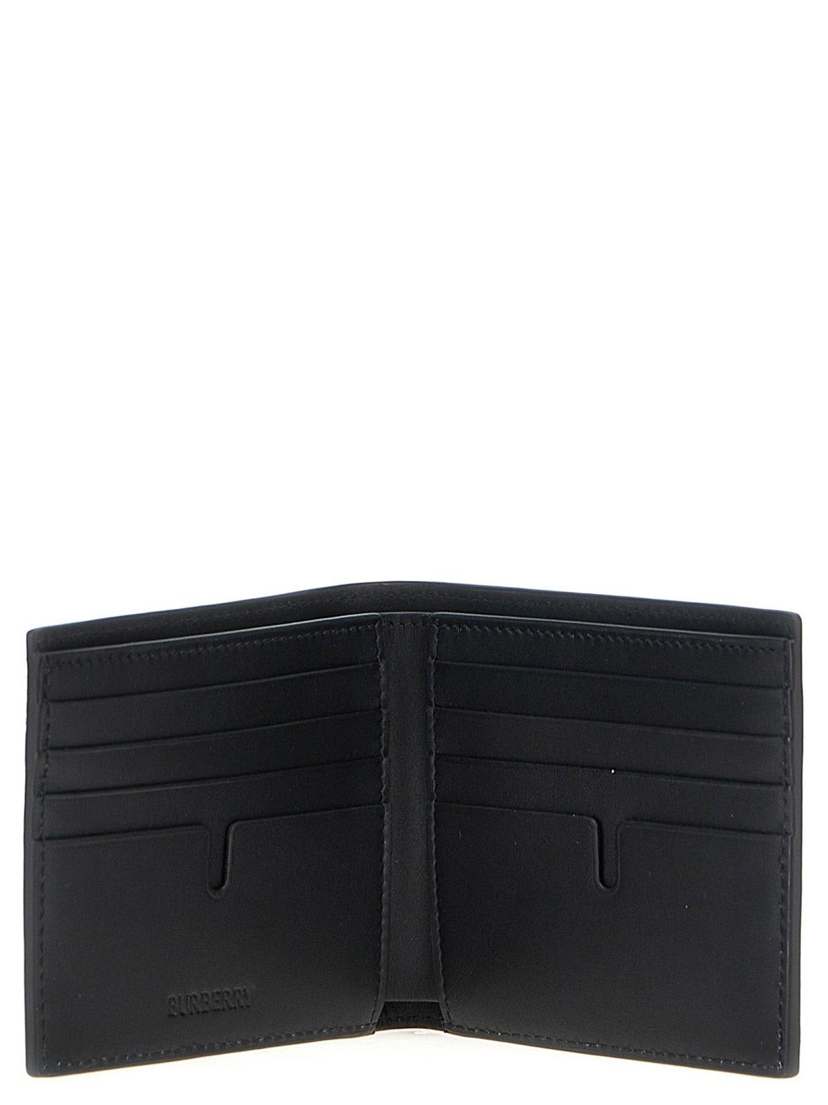 Shop Burberry Check Embossed Bi-fold Wallet In Black