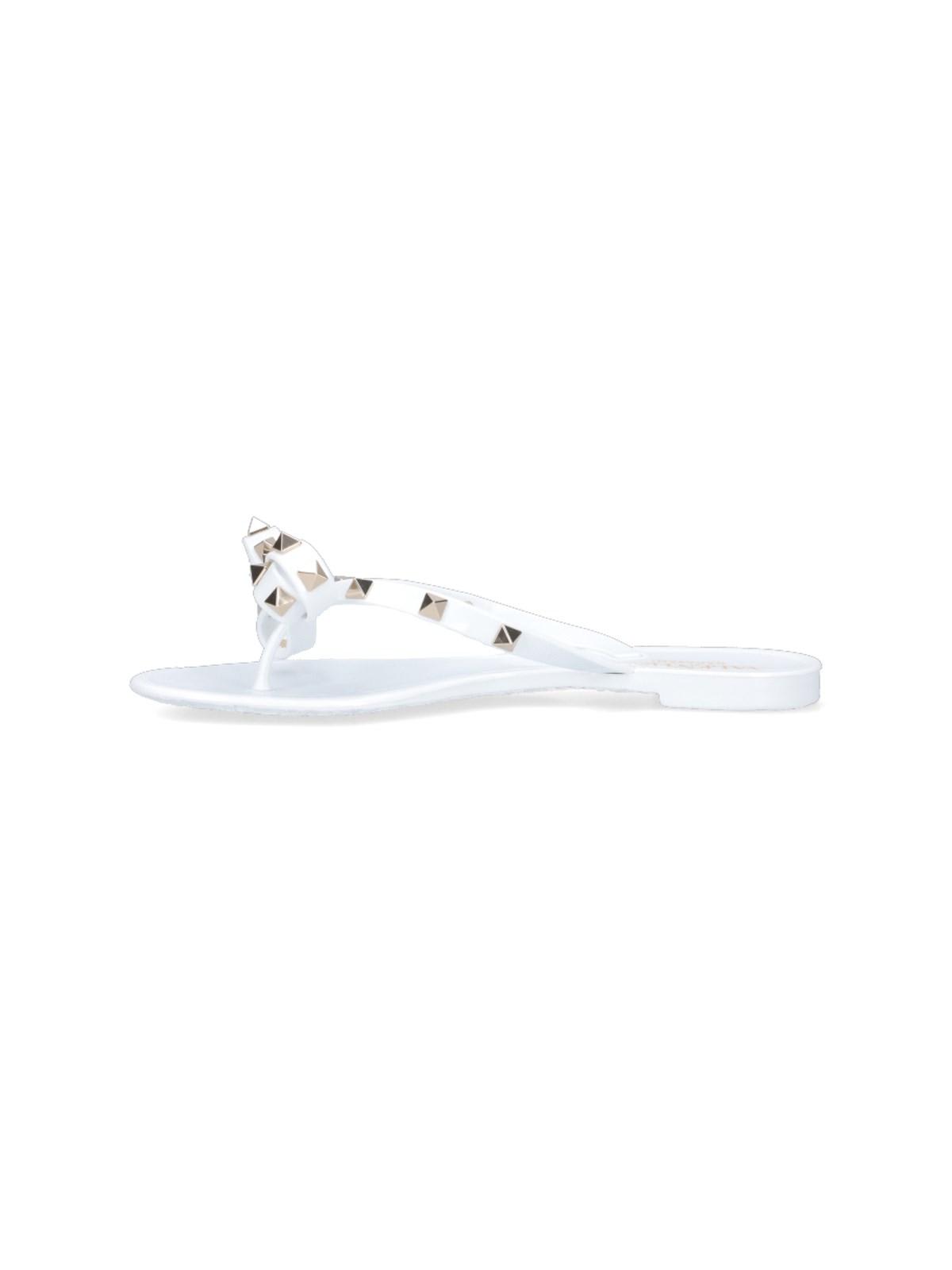 Shop Valentino Thong Sandals Rockstud In White