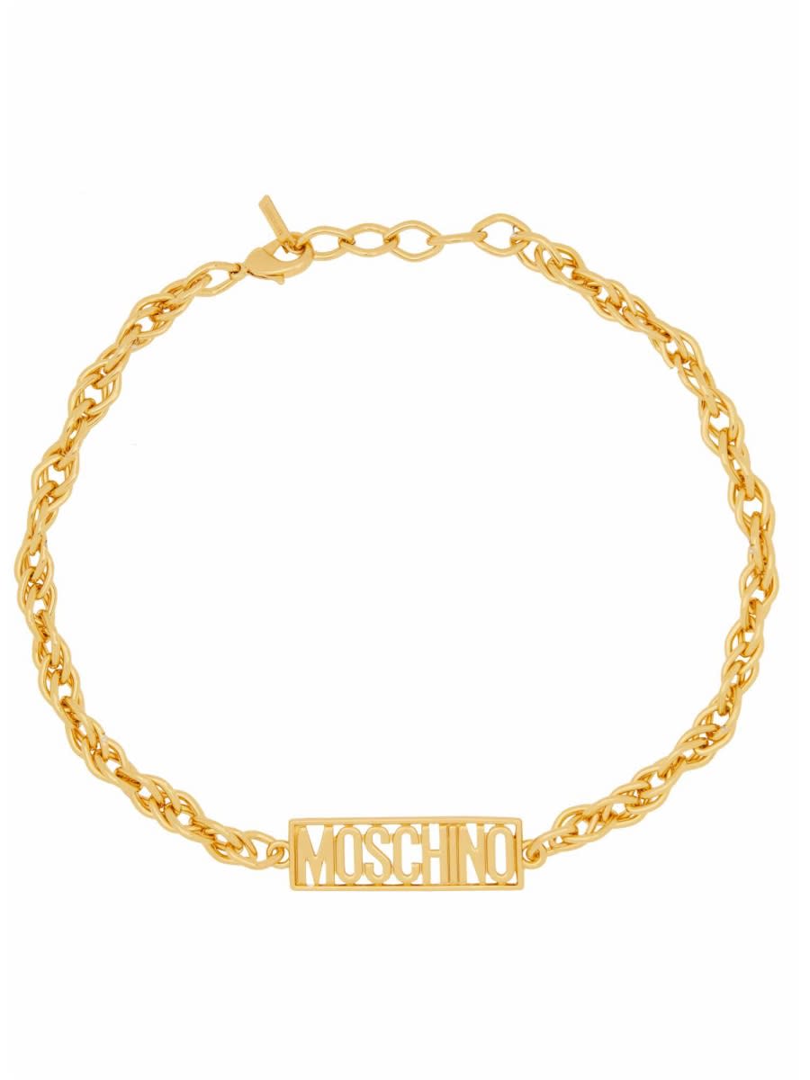 Shop Moschino Logo Bracelet In Gold