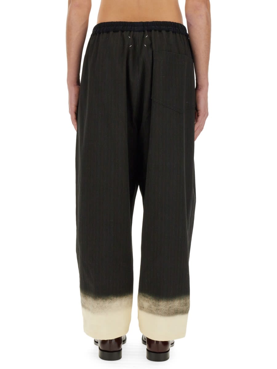 Shop Maison Margiela Trompe Loeil Pinstripe Pants In Black