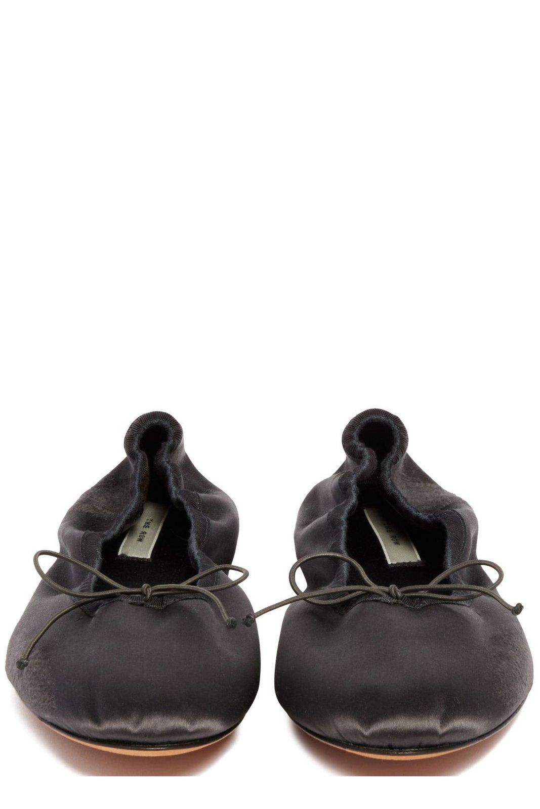 The Row Bow Detailed Slip-on Flat Shoes In Charcoal