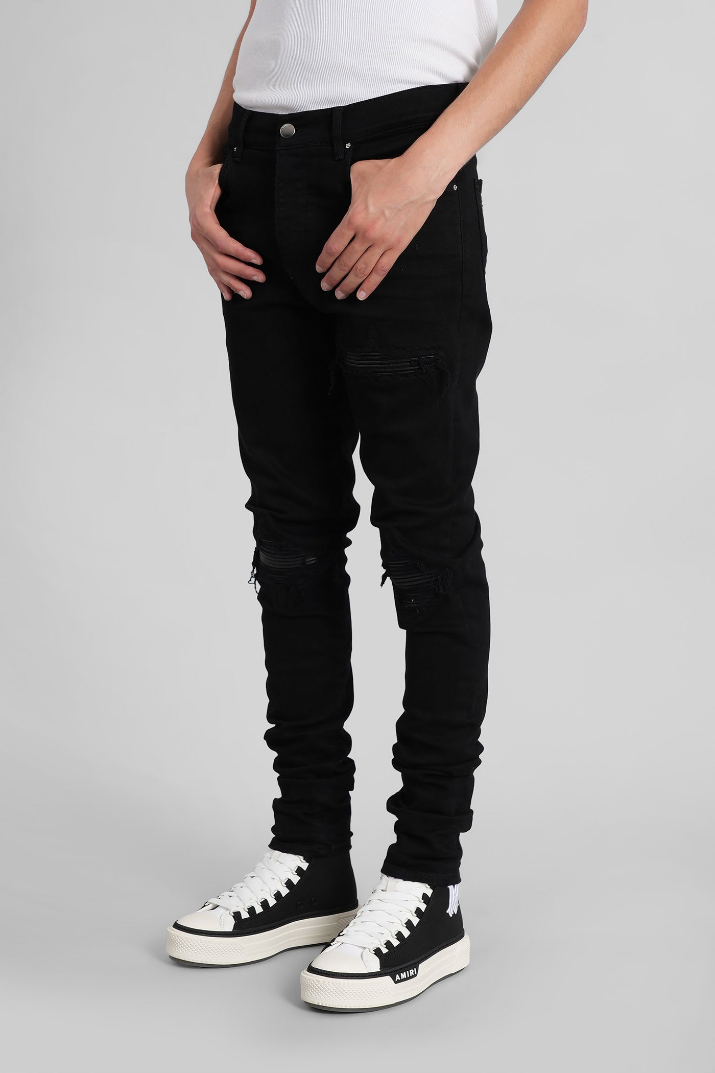 Amiri Slim Fit Distressed Five-pocket Trousers In Black