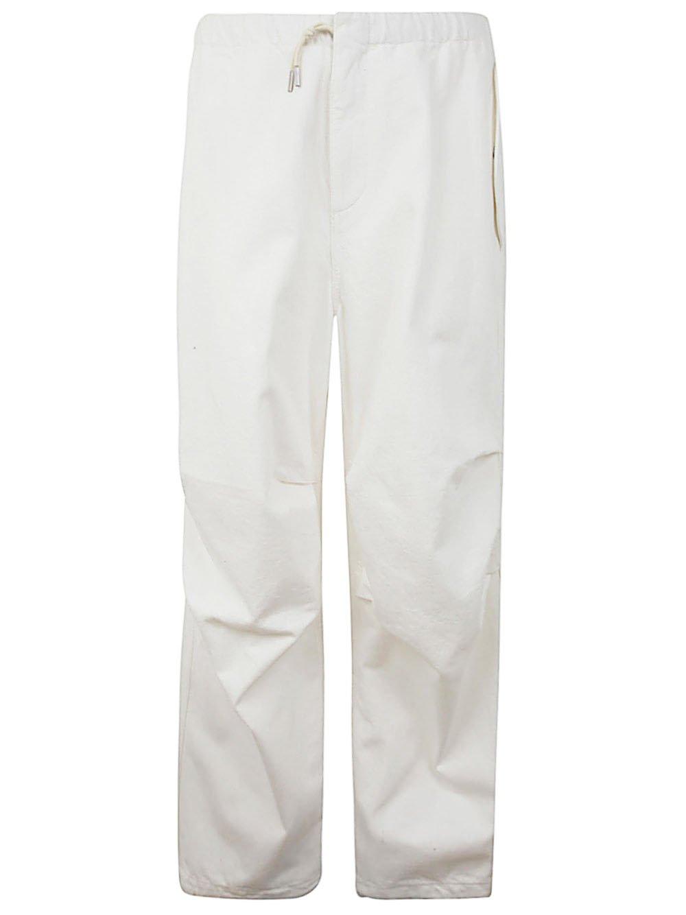 Shop Jil Sander Crimpled-effect Trousers In Cream