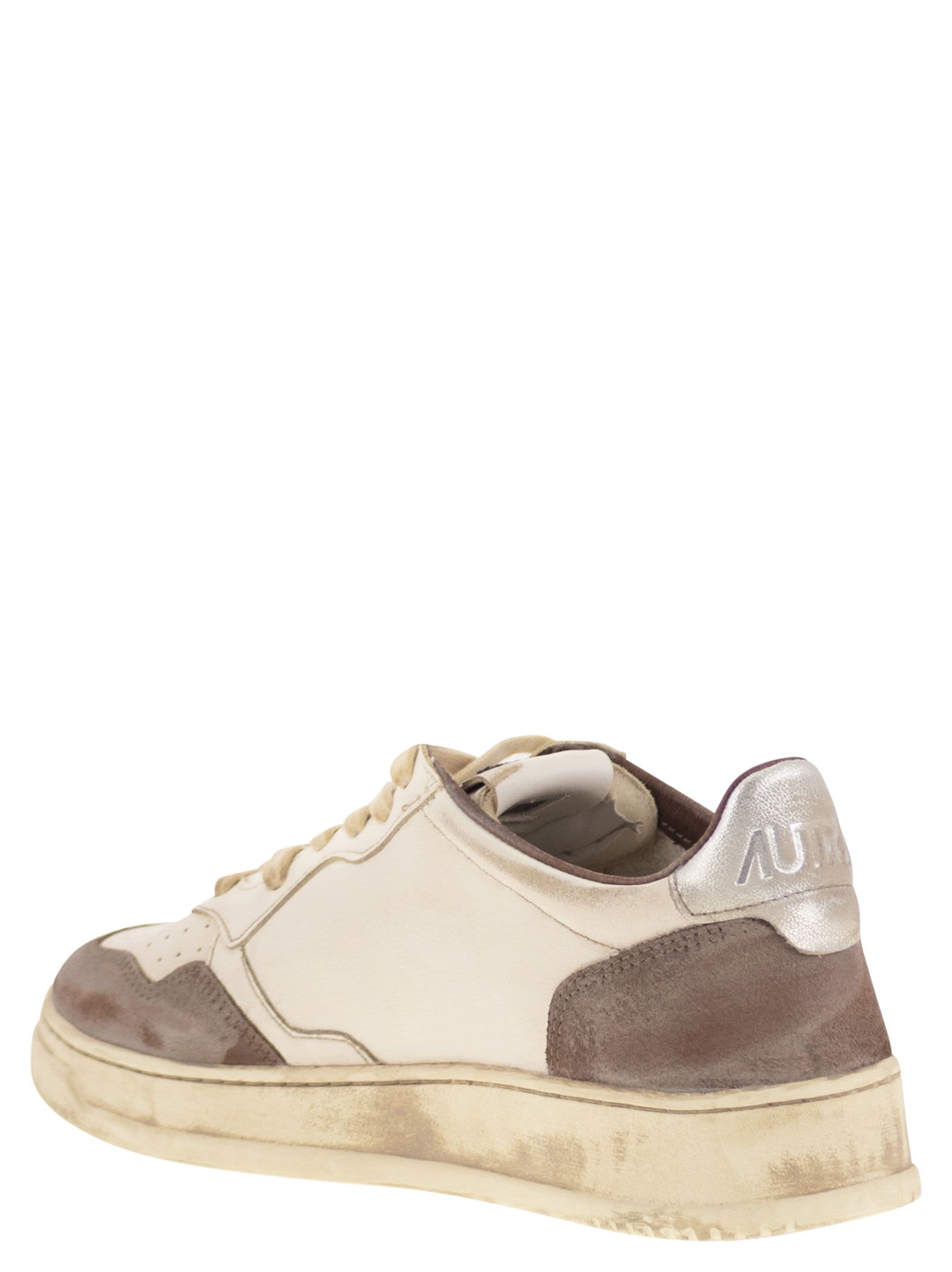 Autry Low Top Sneakers With Contrasting Leather Inserts In White