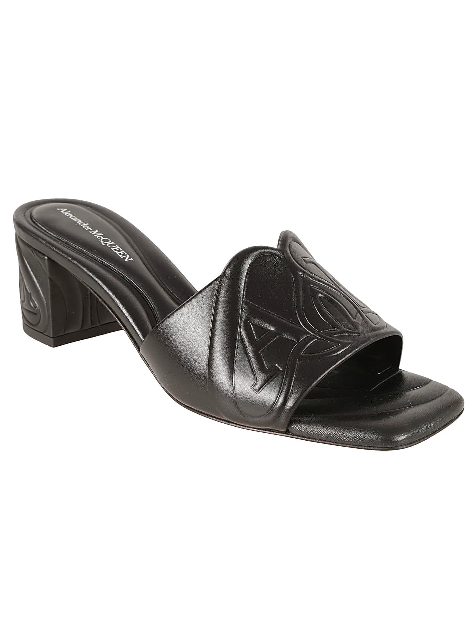 Shop Alexander Mcqueen Block Heel Logo Embossed Sandals In Black