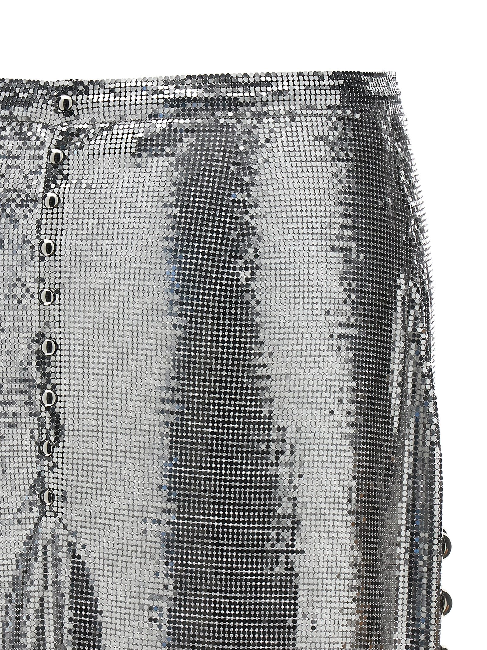 RABANNE SILVER MESH SHORT SKIRT WITH RINGS AND STUDS 