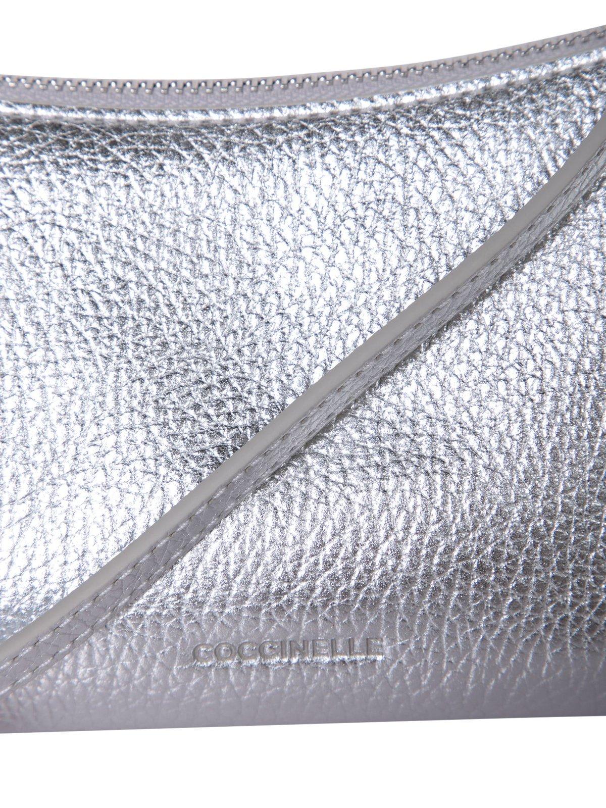 Shop Coccinelle Aura Logo Debossed Shoulder Bag In Silver
