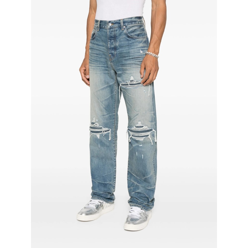 Amiri Men Blue Jeans With Ripped Details On The Front And Logo Patch On The Rear In Denim Man In Blue