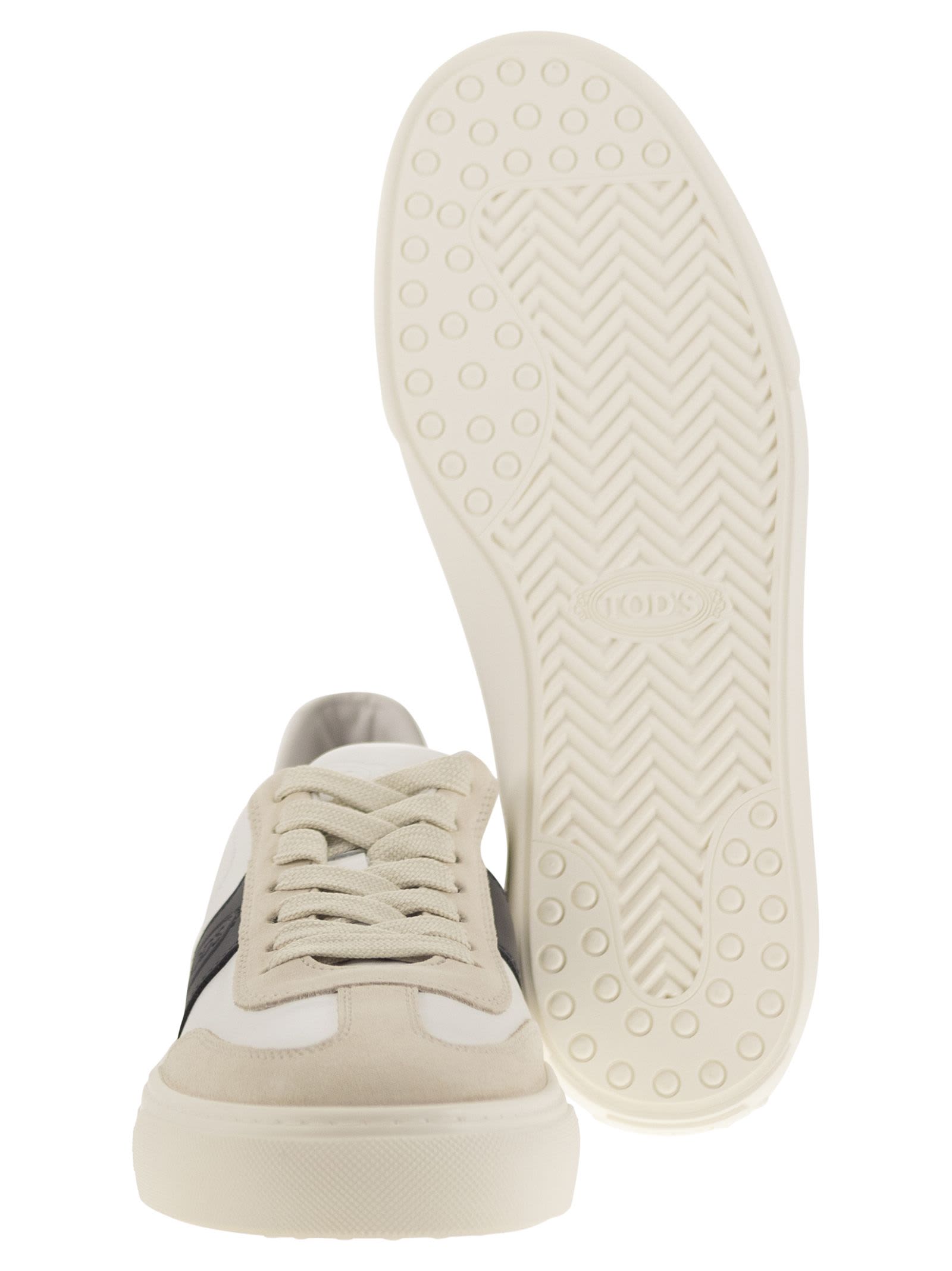 Shop Tod's Leather Sneakers In Milk