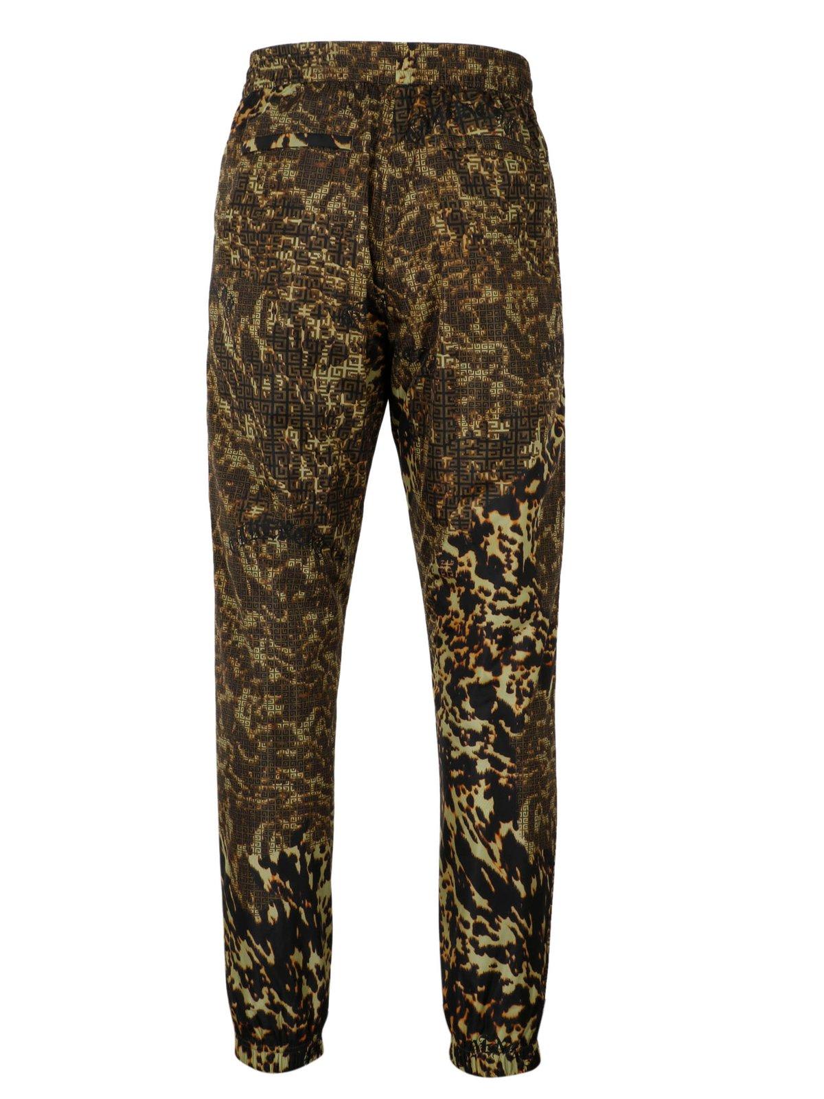 Shop Givenchy 4g Printed Straight Leg Joggers In Green