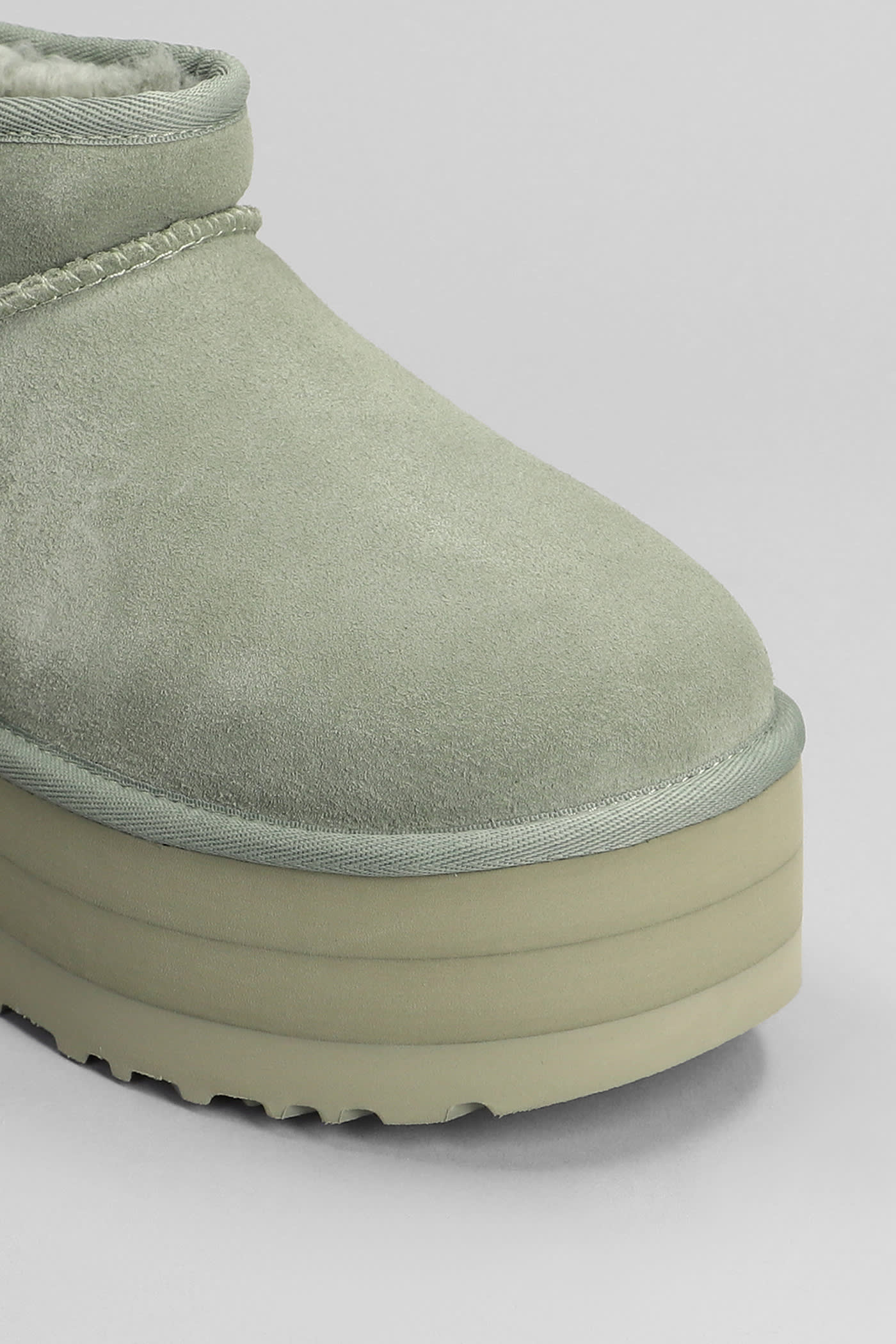 Shop Ugg Classic Ultra Mini P Low Heels Ankle Boots In Green Suede