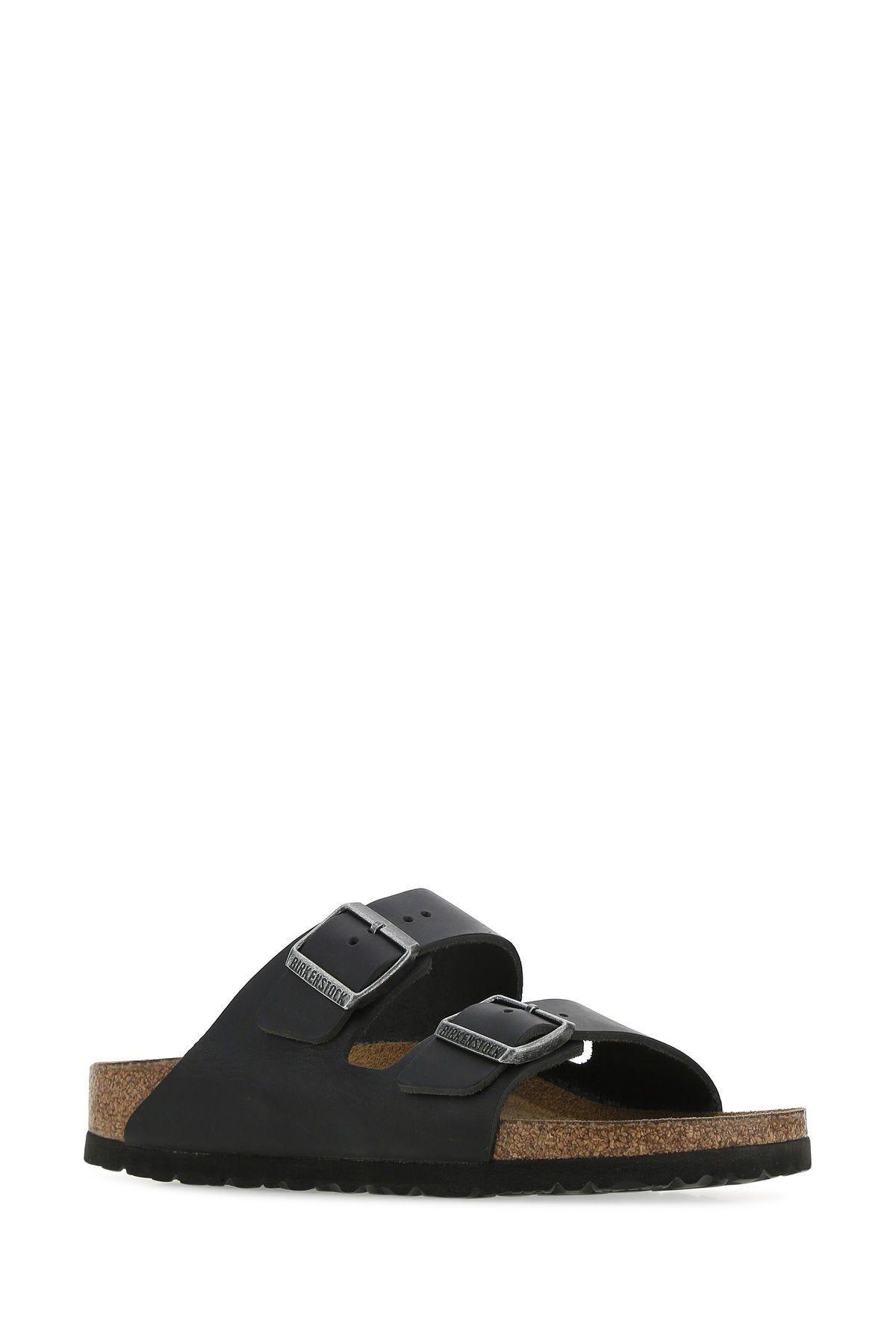 Shop Birkenstock Black Leather Arizona Slippers