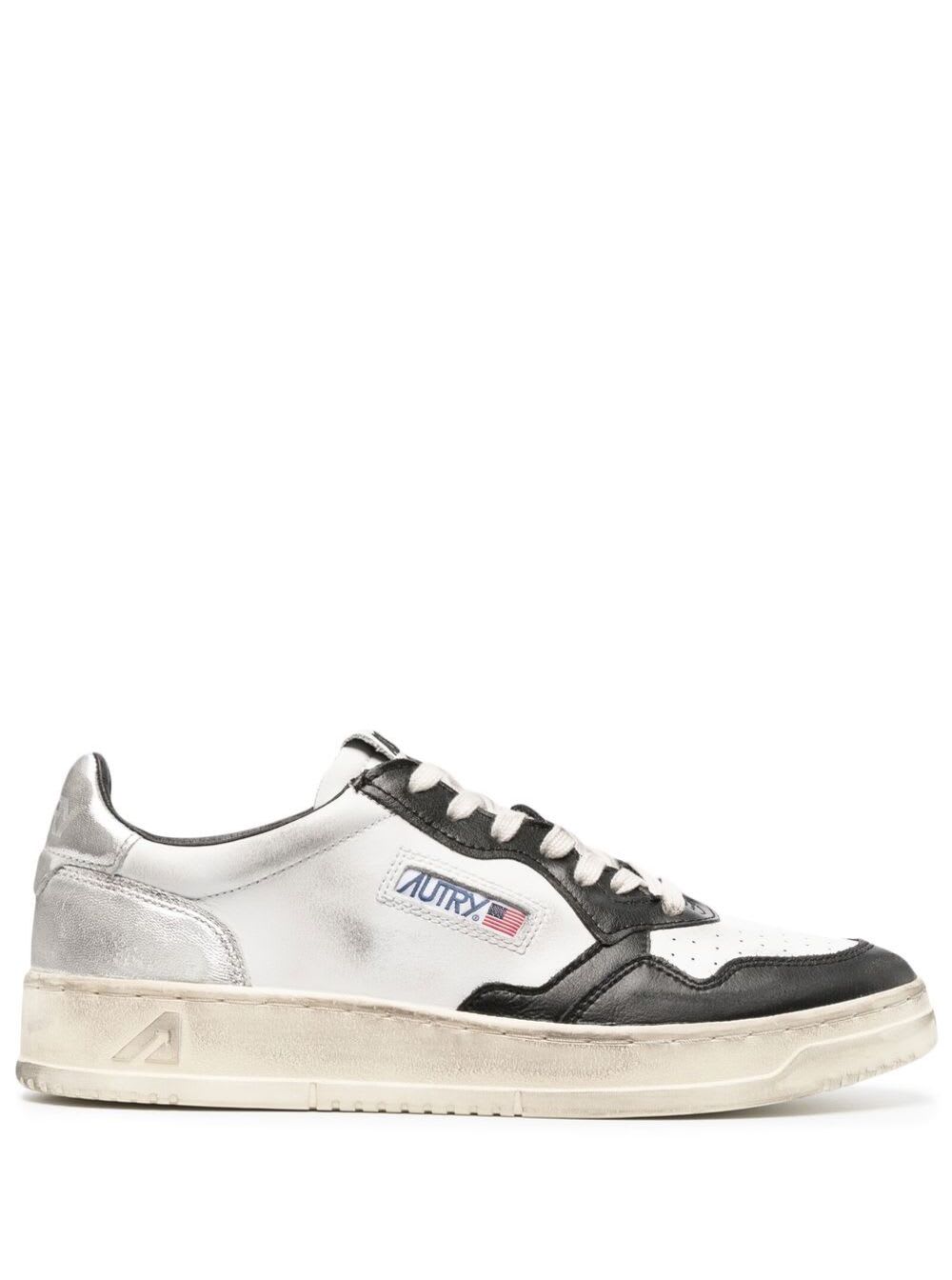 Shop Autry Black And White Medalist Low Top Sneakers Distressed Finish In Cow Leather