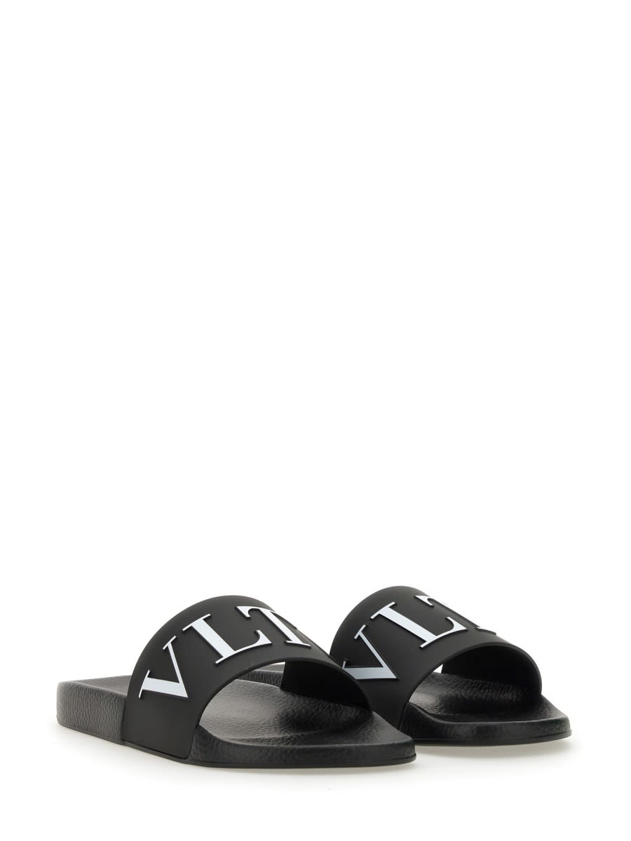 Shop Valentino Slide Sandal With Logo In Black