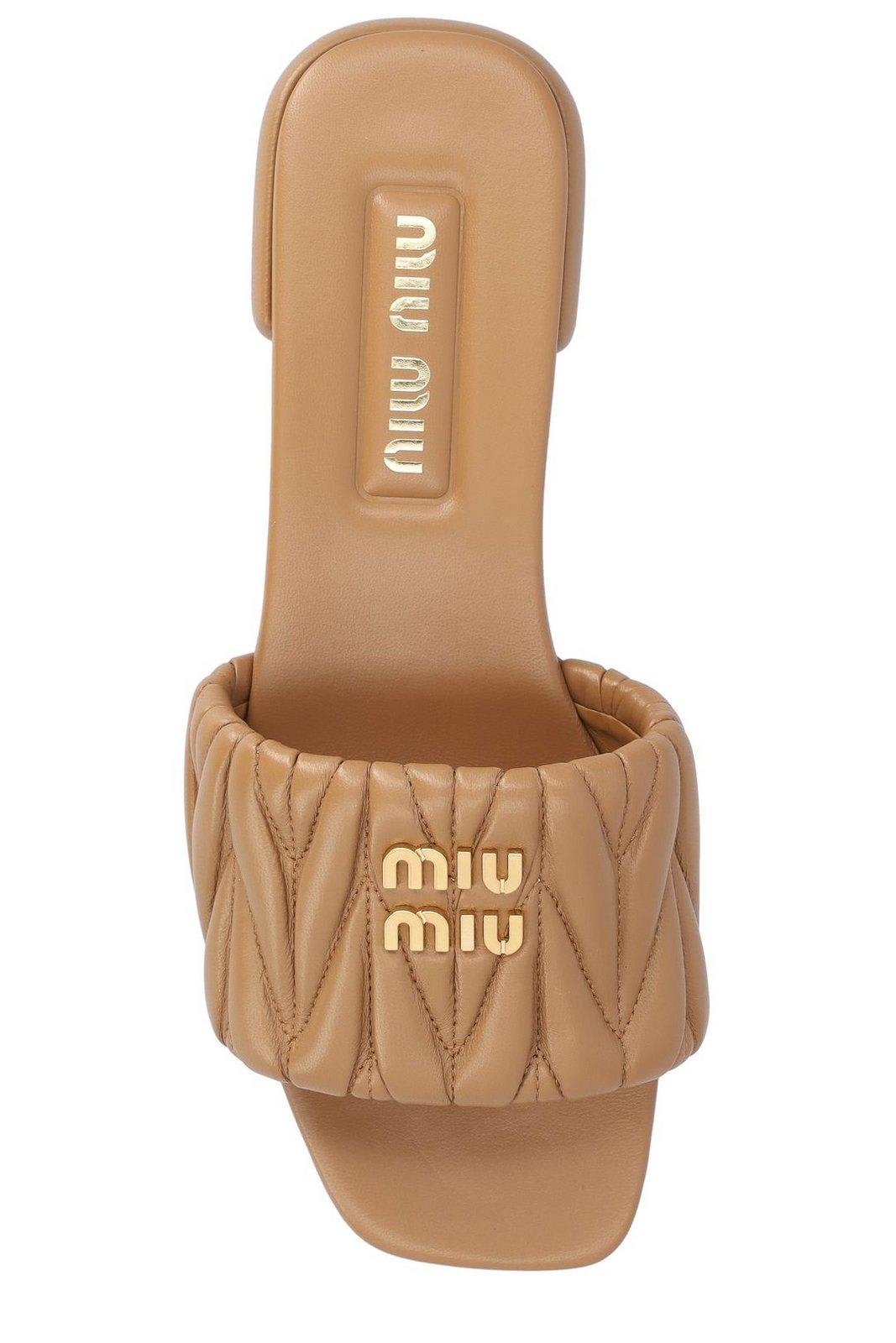 Shop Miu Miu Logo Quilted Sliders In Brown