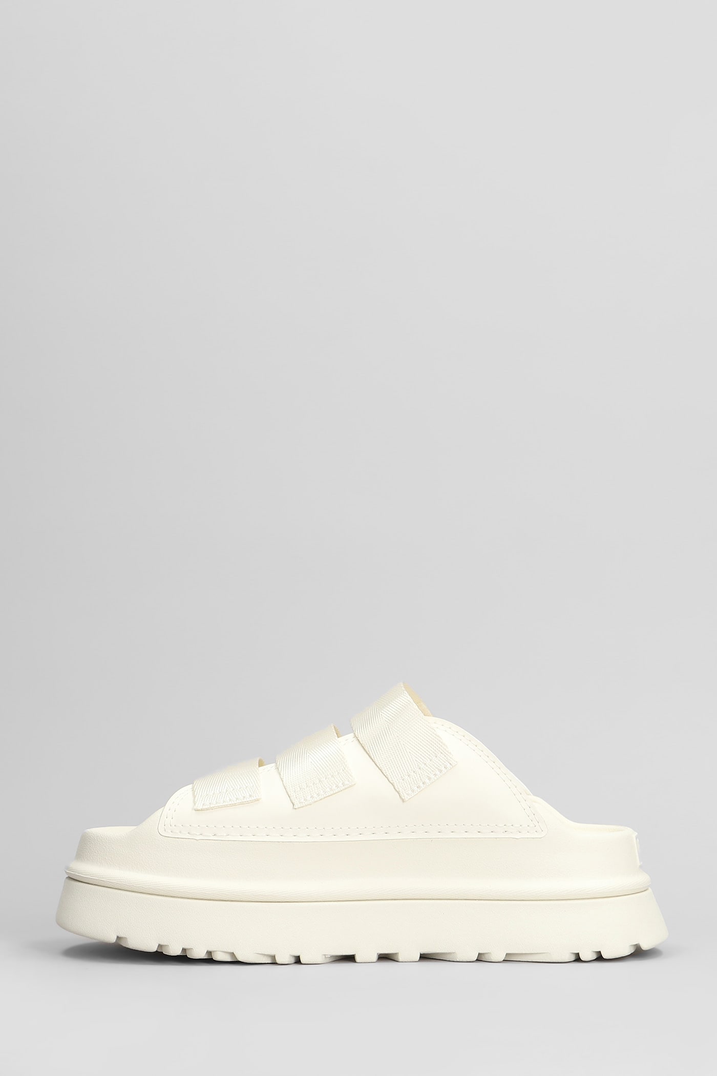 UGG GOLDENGLOW SLIDE SLIPPER-MULE IN BEIGE RUBBER/PLASIC