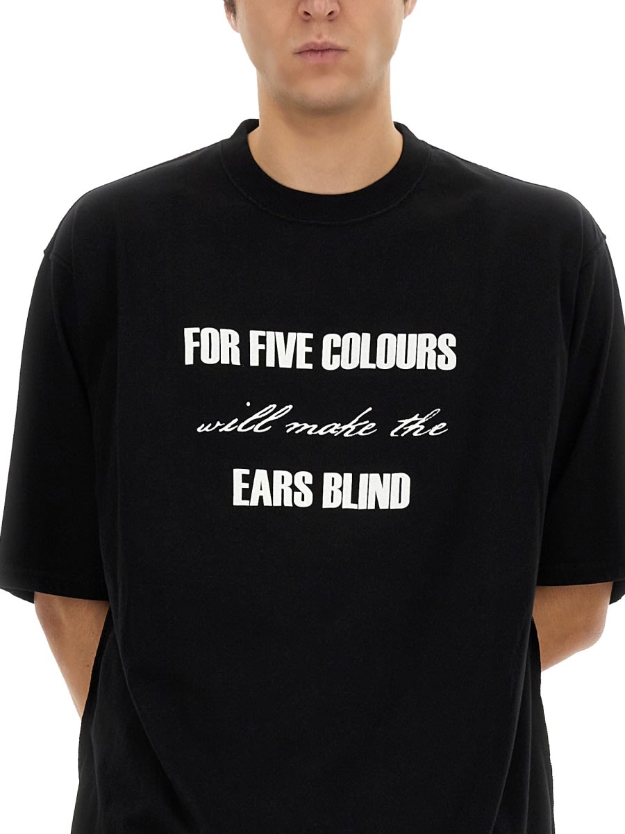 Undercover Graphic Print Black T-shirt With Exposed-seam Detailing And Logo Patch In Black