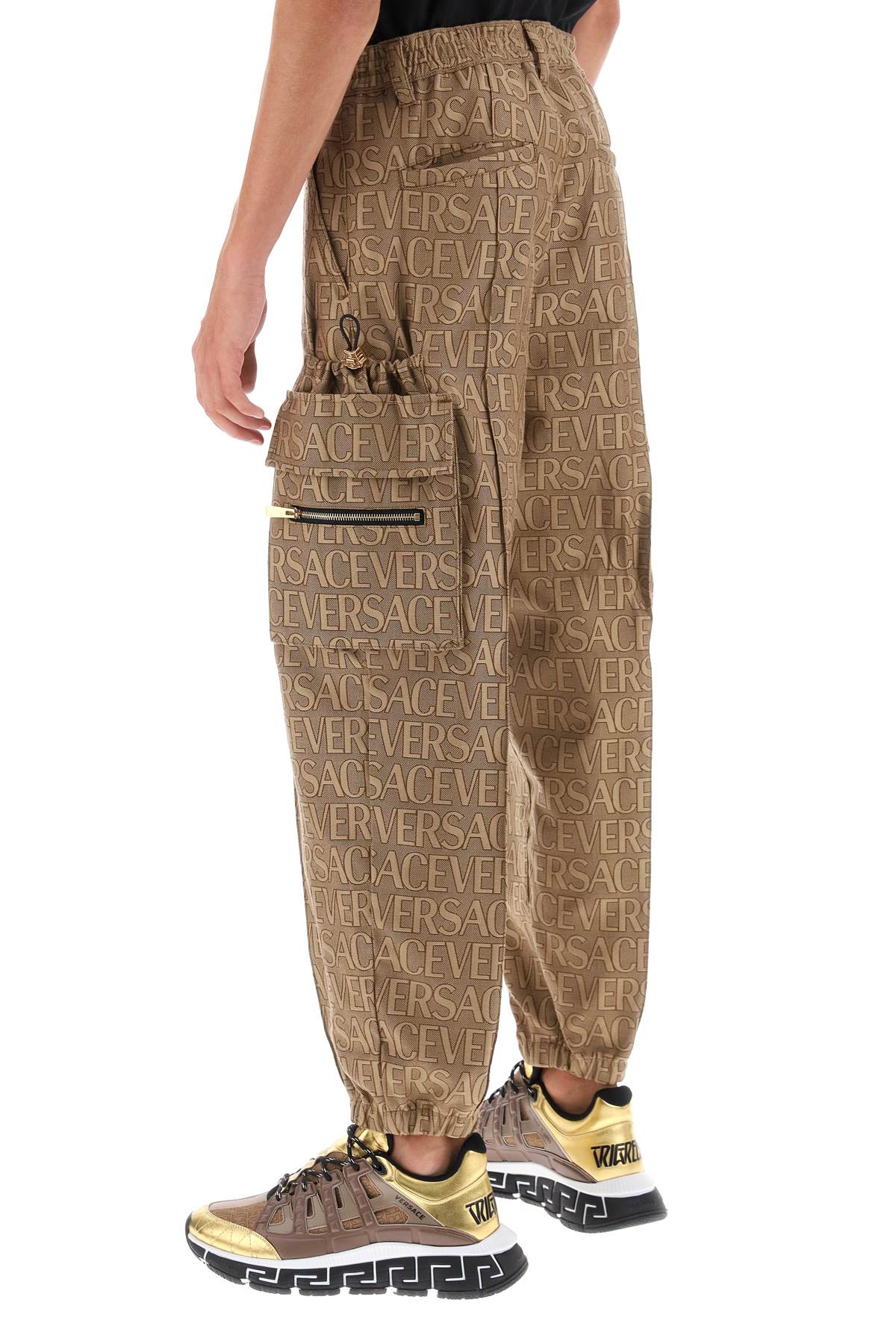 Shop Versace Allover Cargo Pants In Brown Beige (brown)