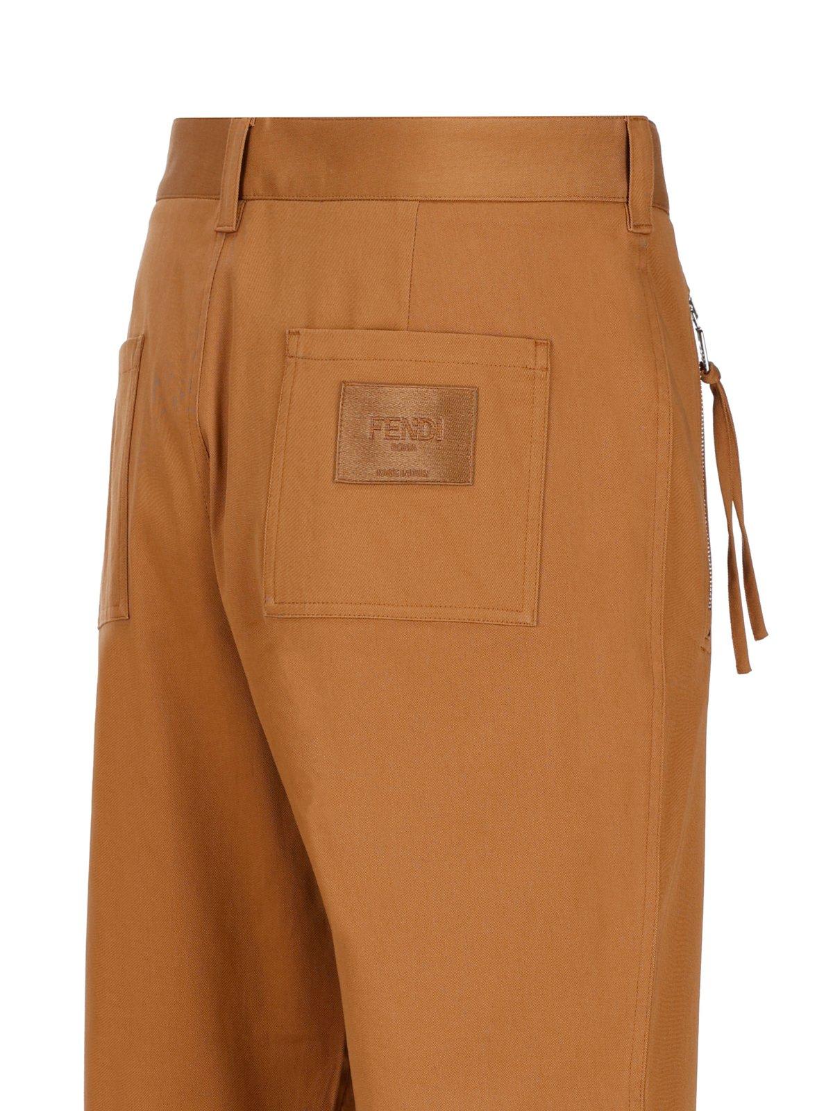 Shop Fendi Logo-embroidered Cigarette Pants In Brown