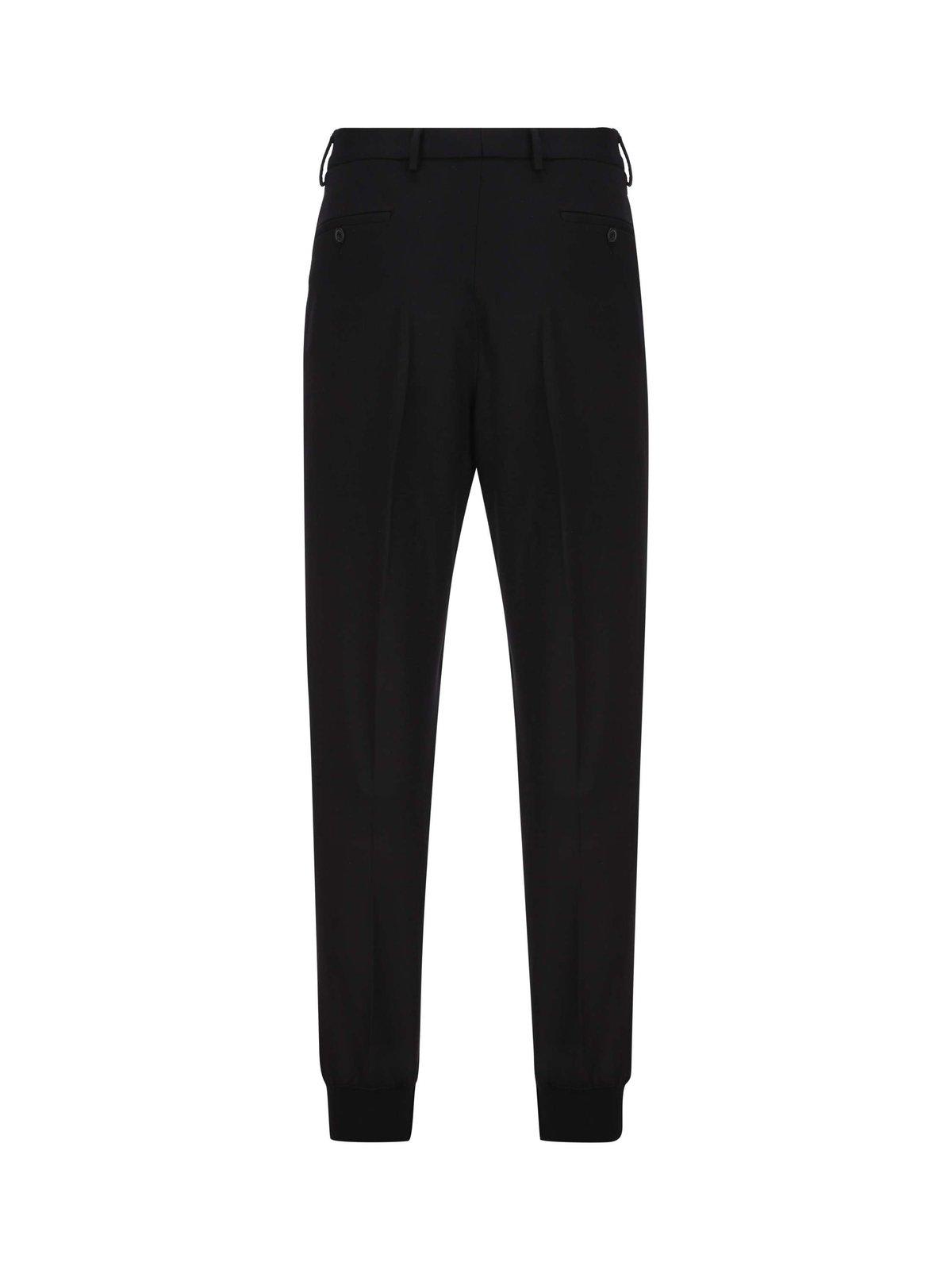 Shop Prada Buttoned Tapered Leg Pants In F0002