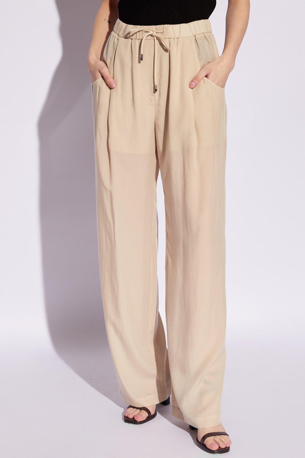 Shop Emporio Armani Loose Fitting Trousers In Beige